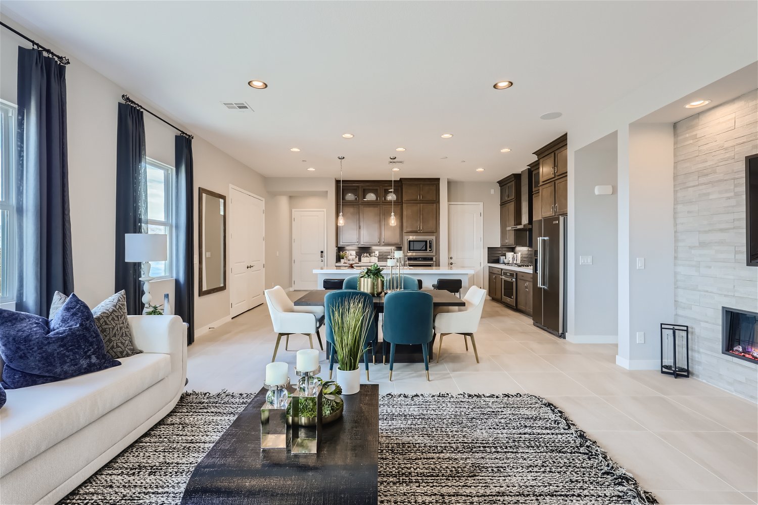 A living room with a dining table and couches.