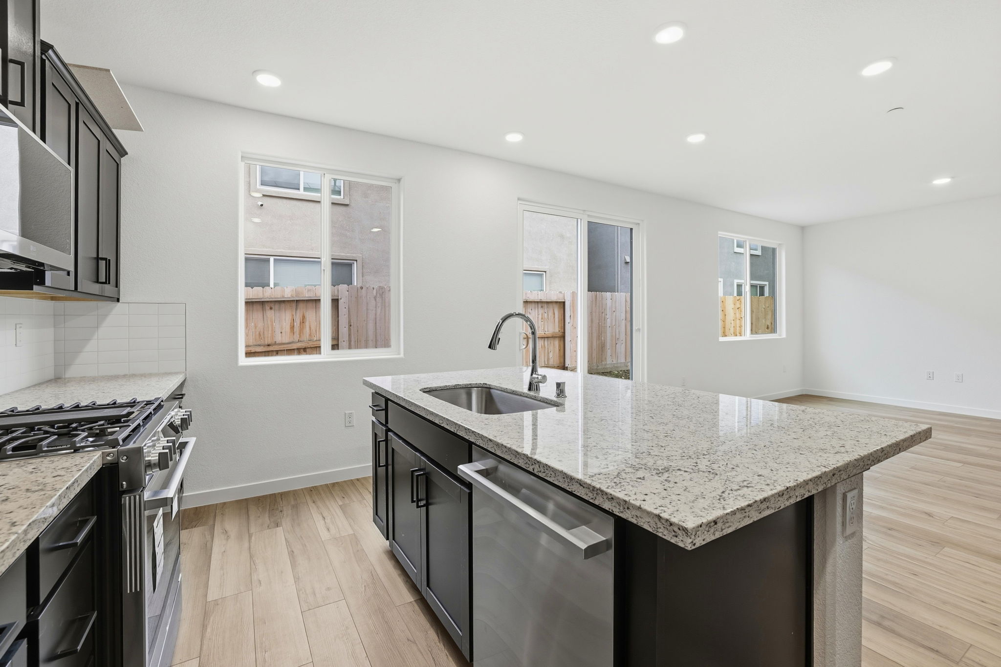 A kitchen with a marble countertop.