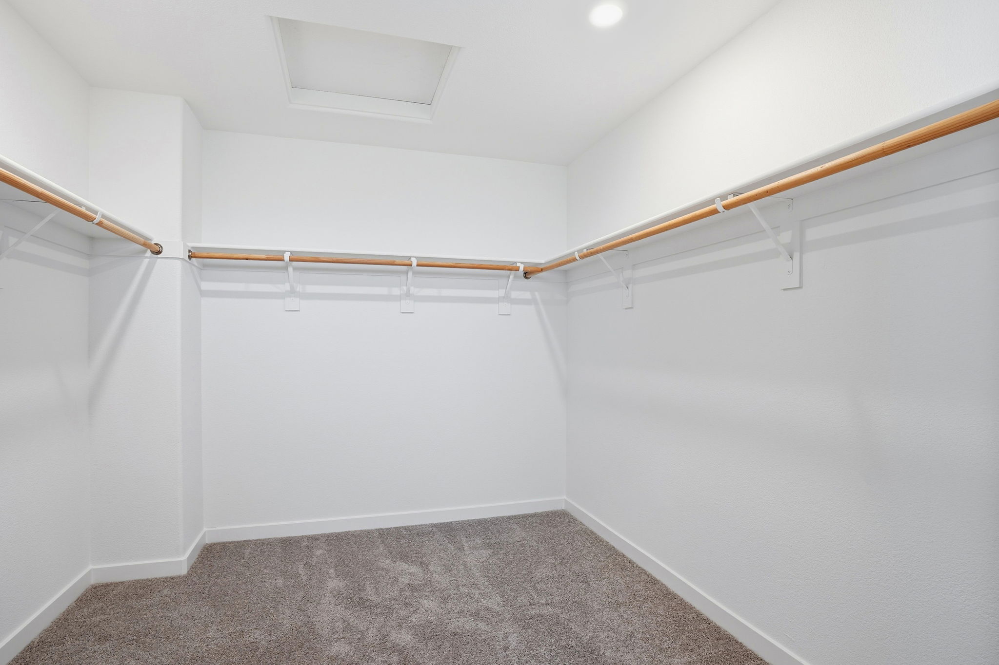 A white room with a carpet and a carpet.