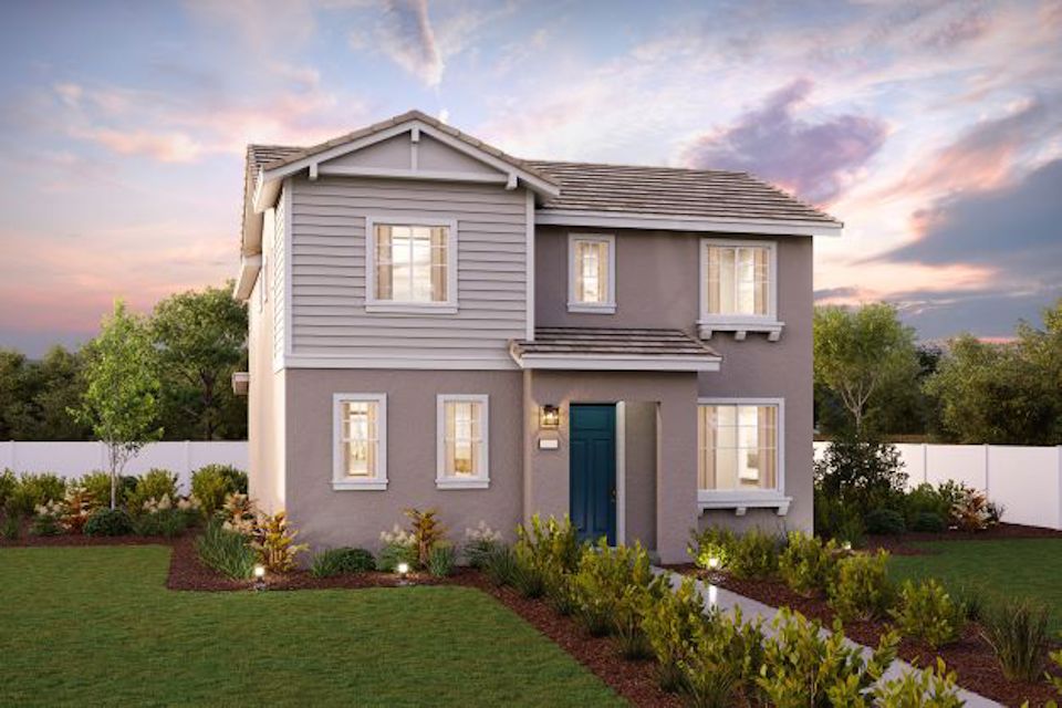 A house with a yard and a fence.