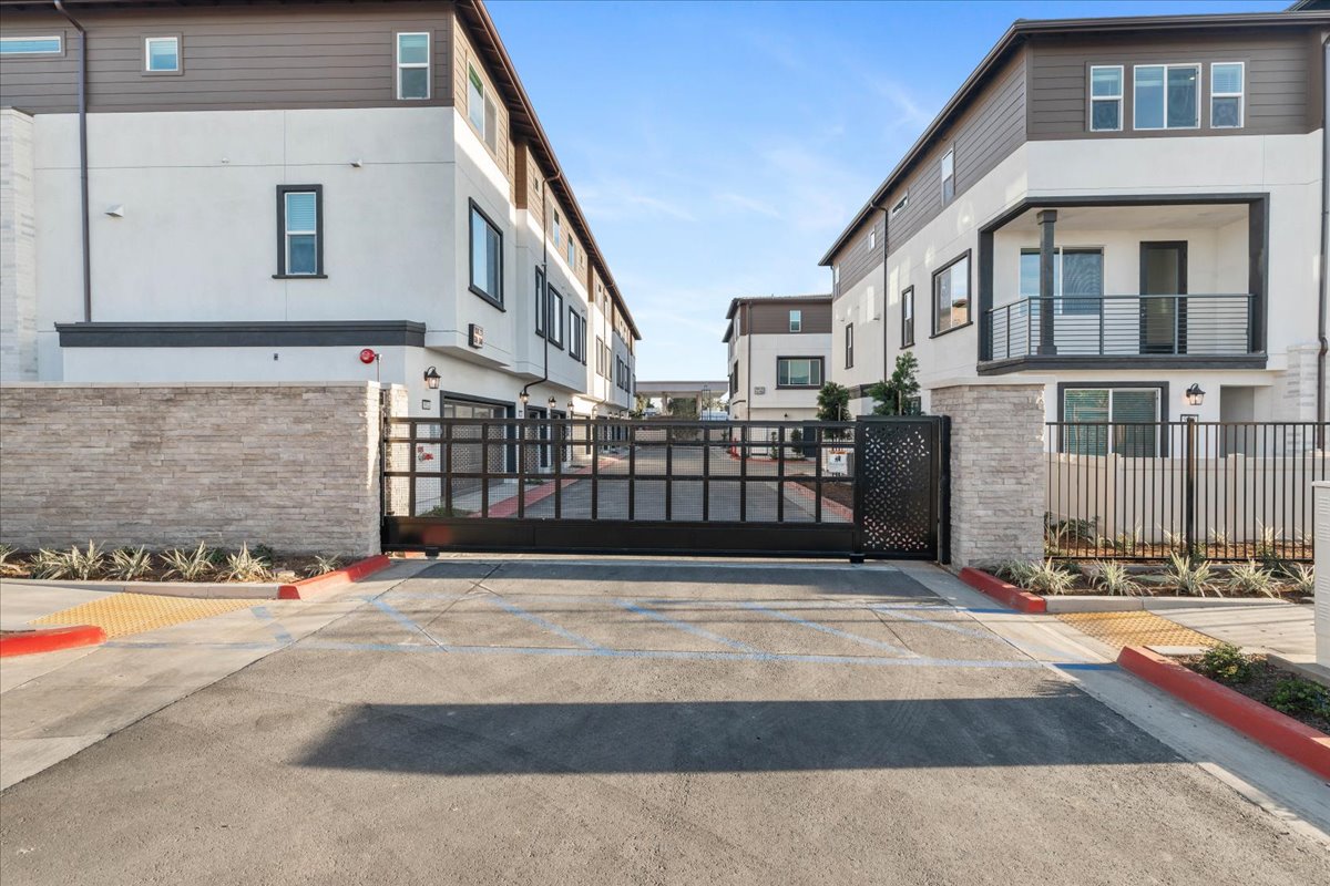 A gated off area with buildings around it.