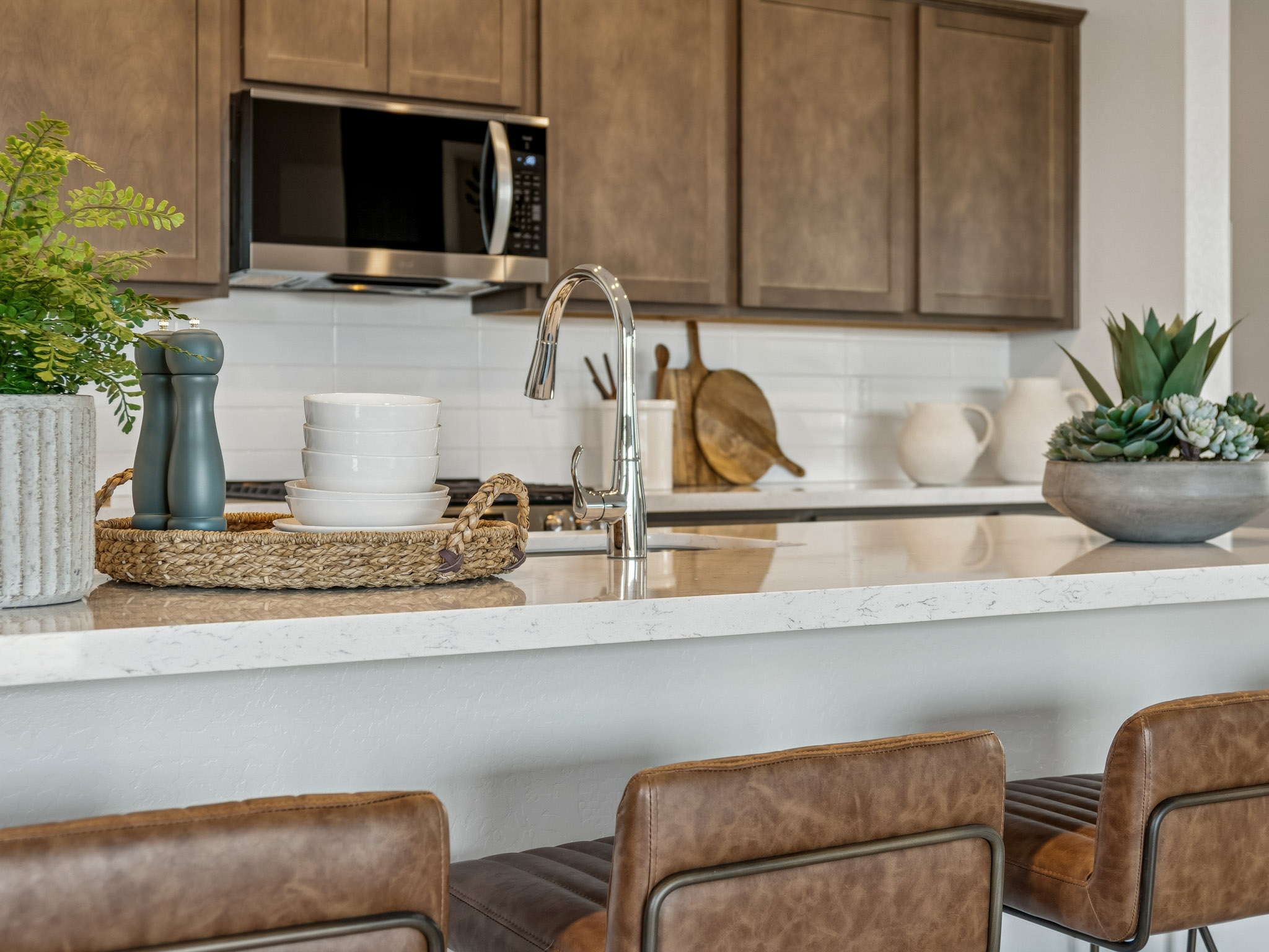 A kitchen with a sink and a stove.