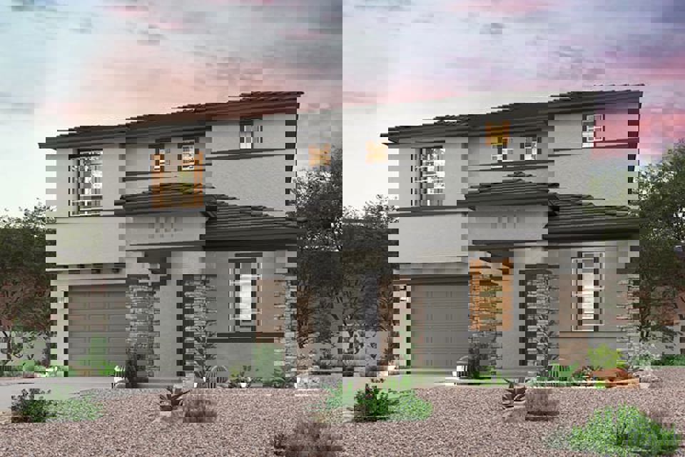 A house with a garage with Green-Meldrim House in the background.