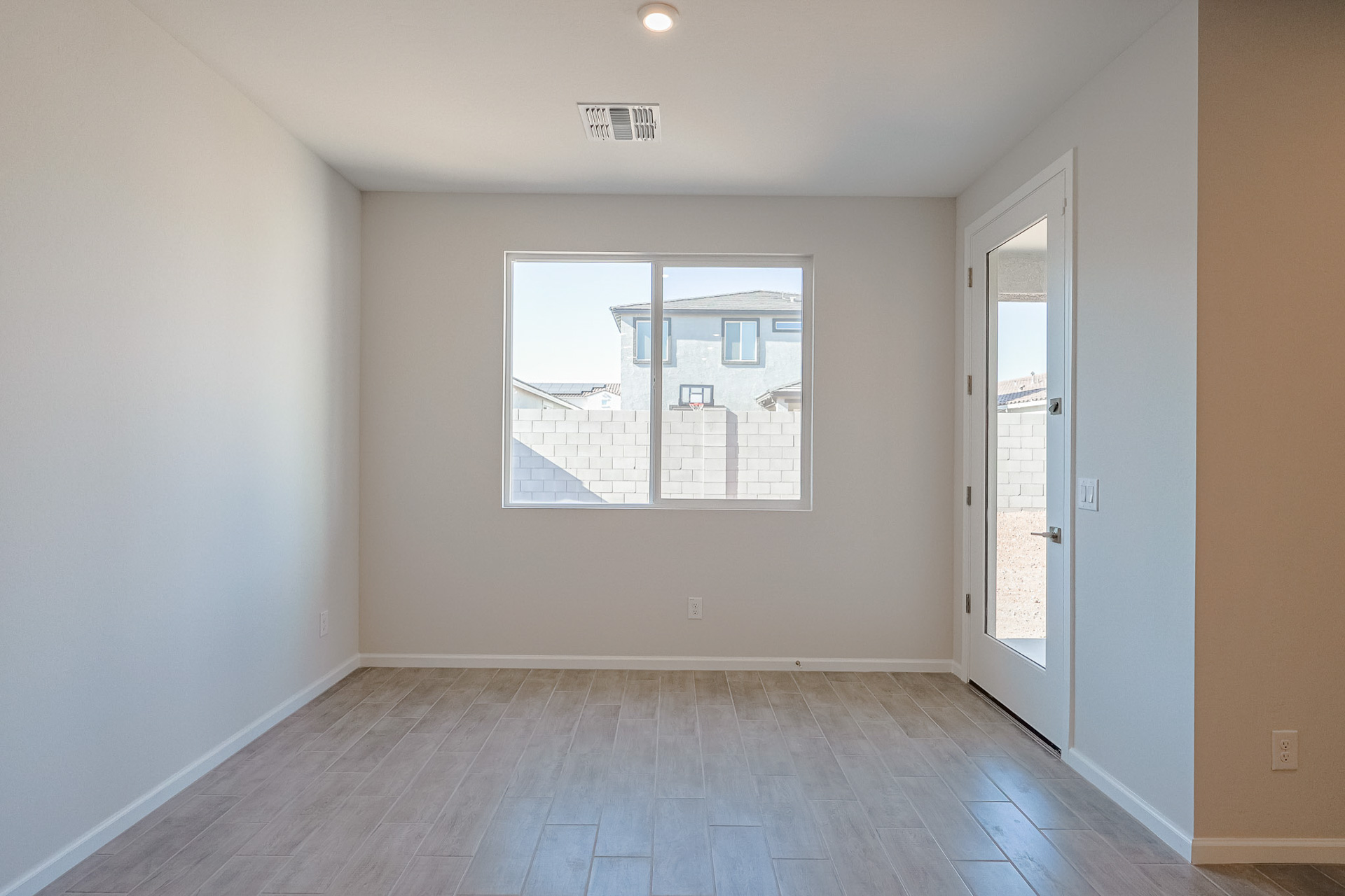 A room with a large window.