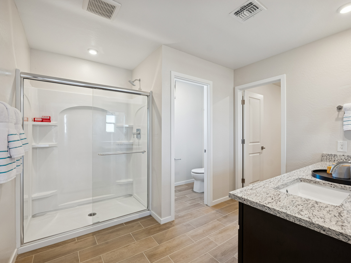 A bathroom with a glass shower.