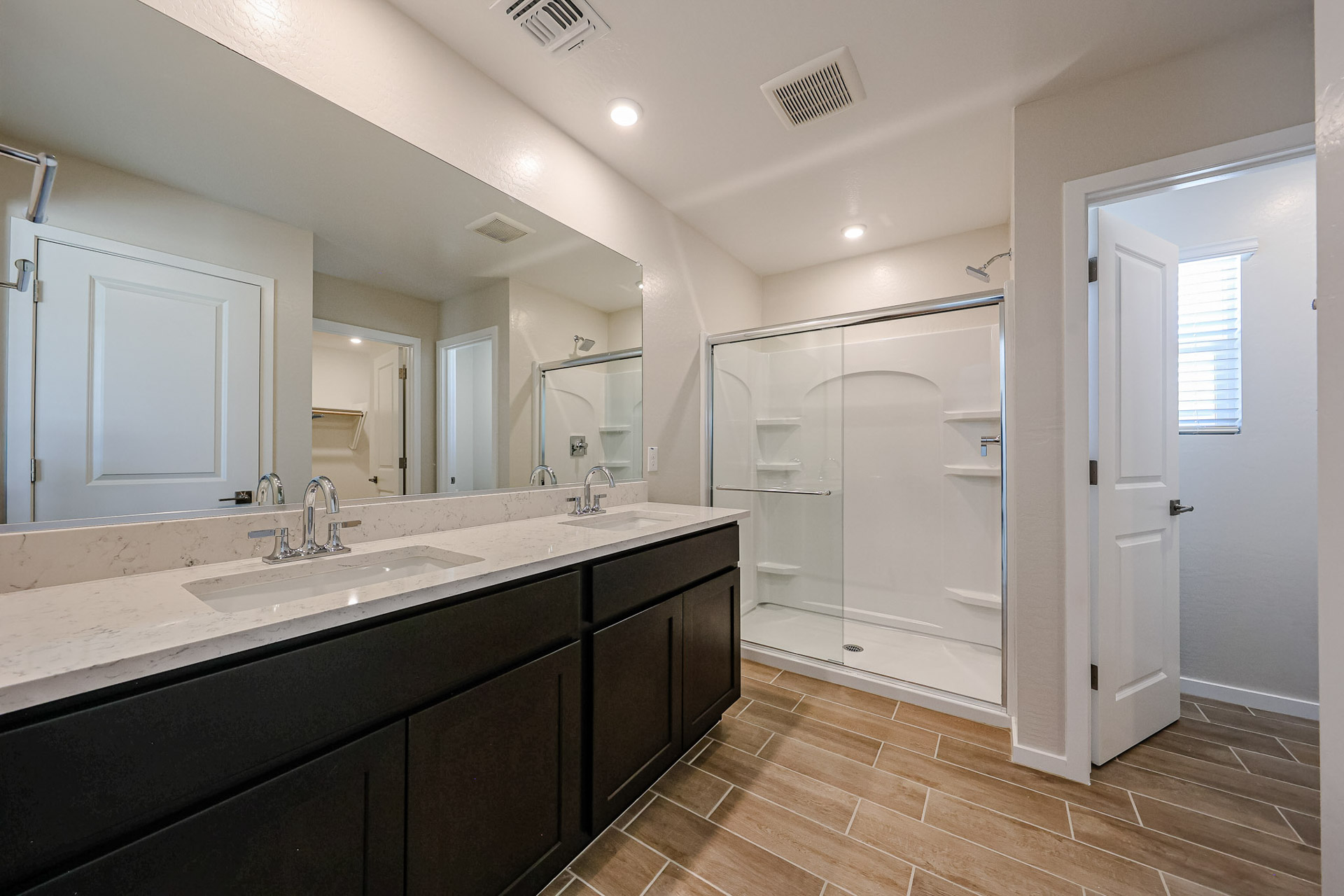 A bathroom with a large glass shower.