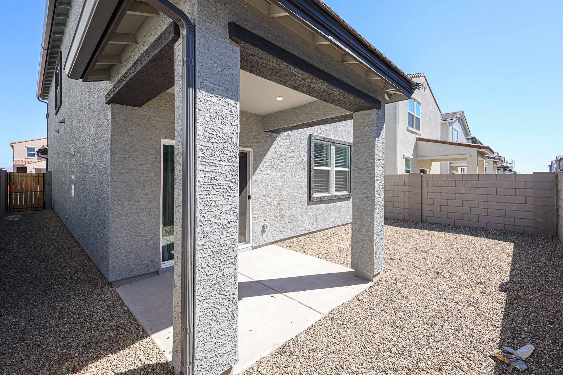 A building with a stone patio.