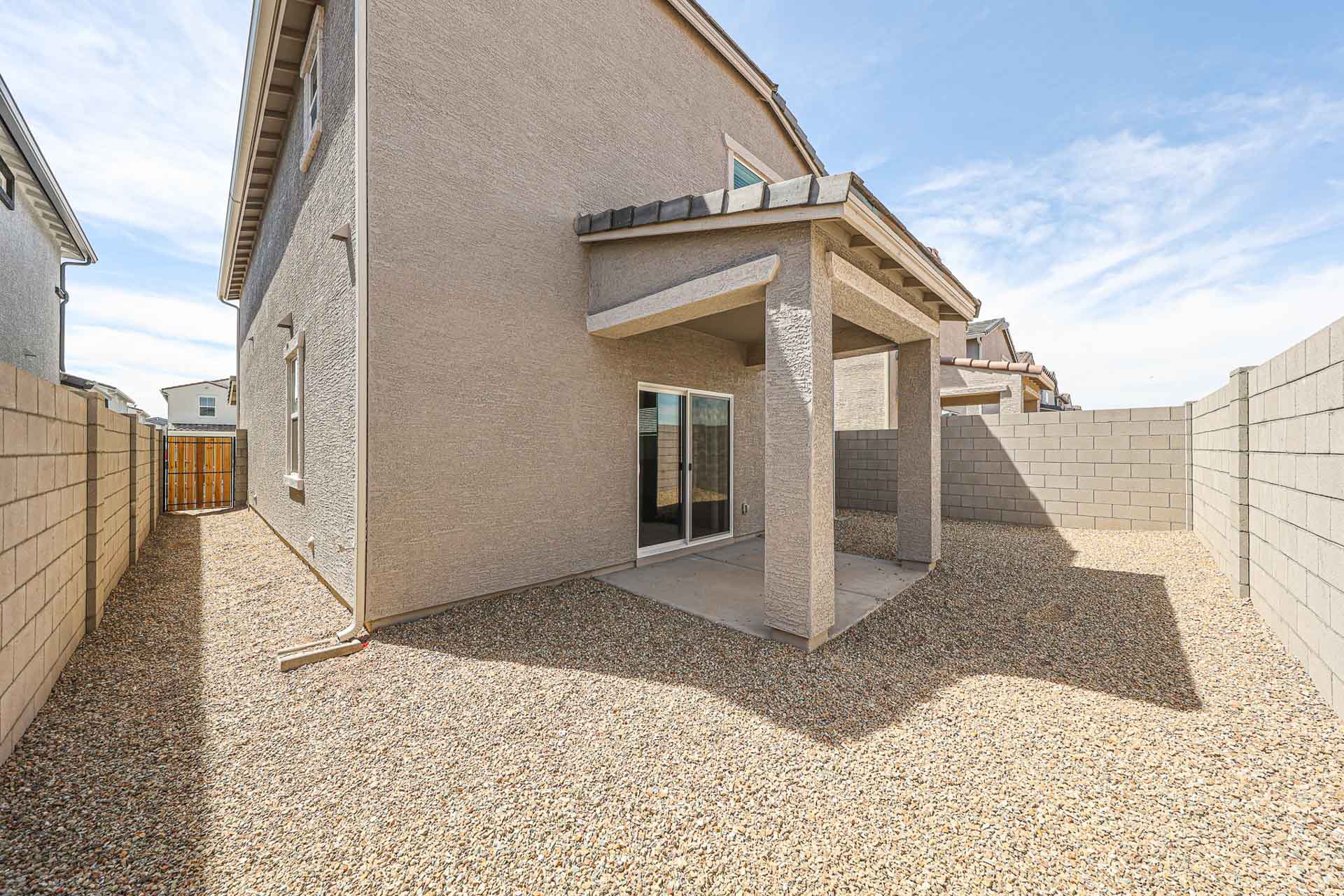A building with a stone patio.