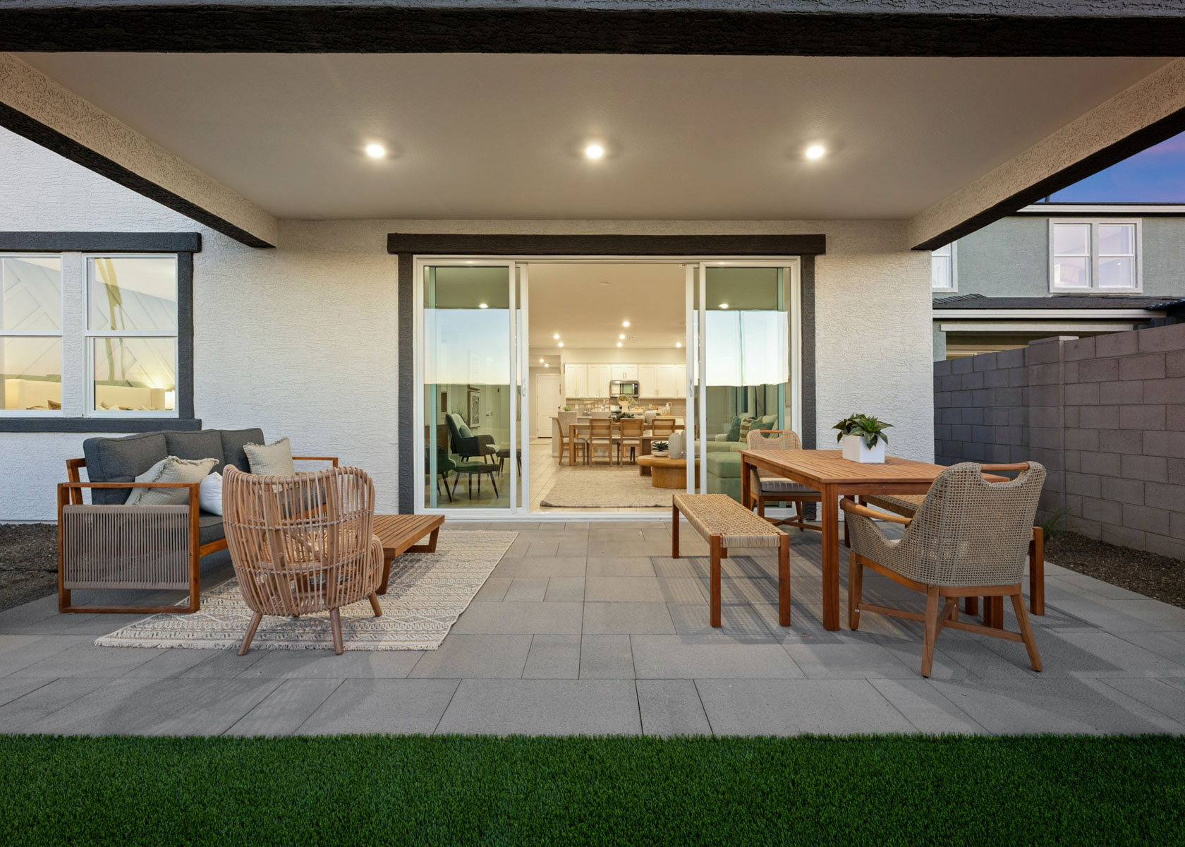 A room with a table chairs and a couch.