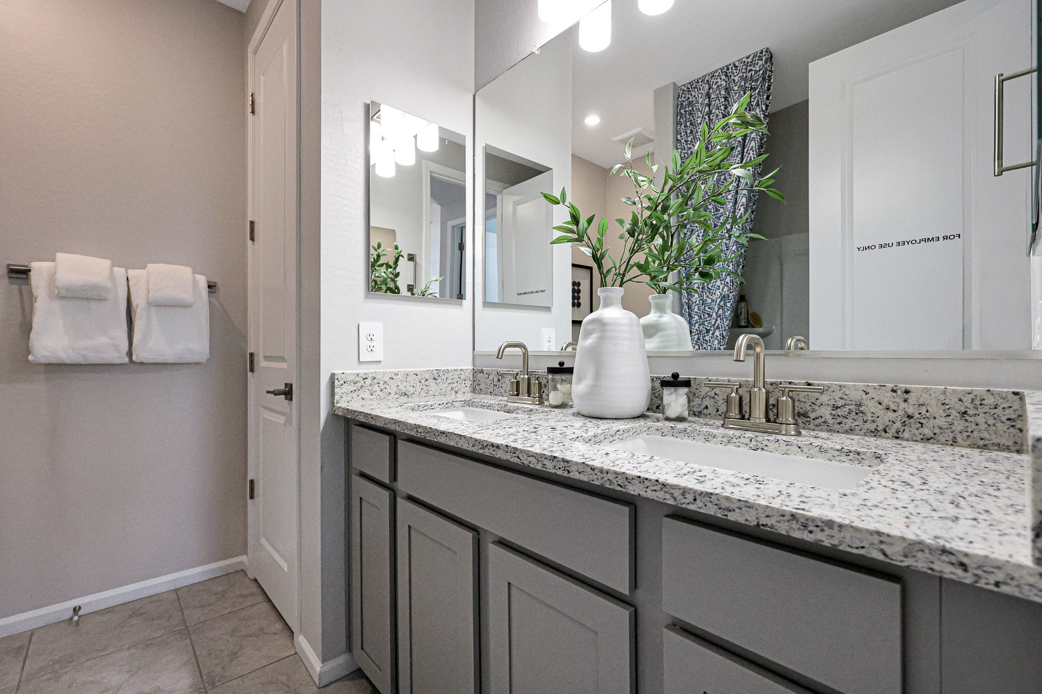 A bathroom with a marble countertop.