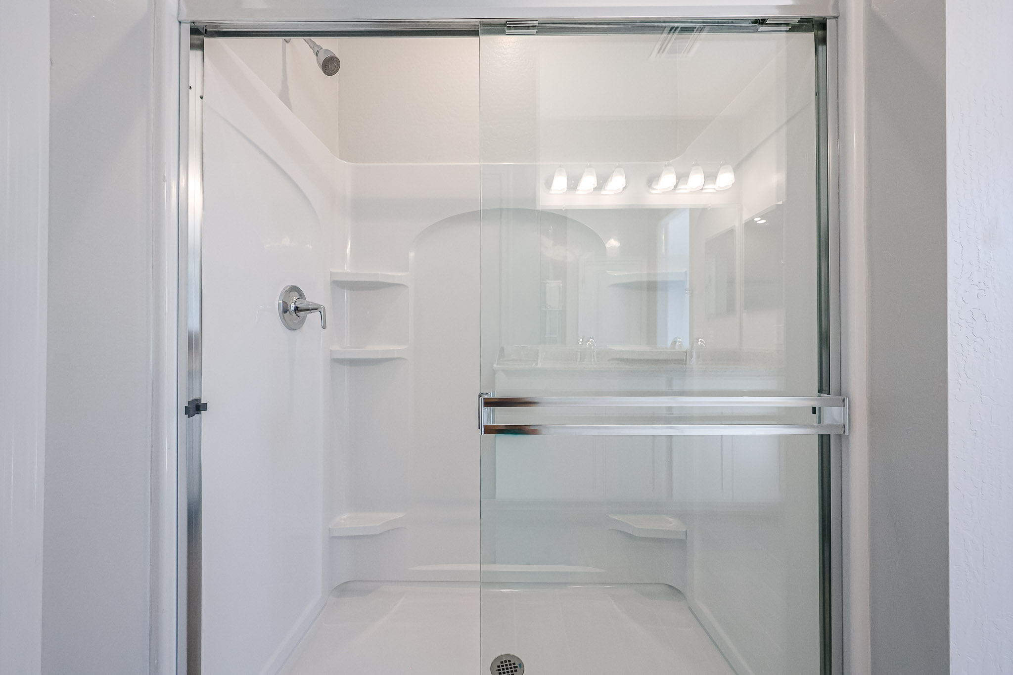 A bathroom with a glass shower.