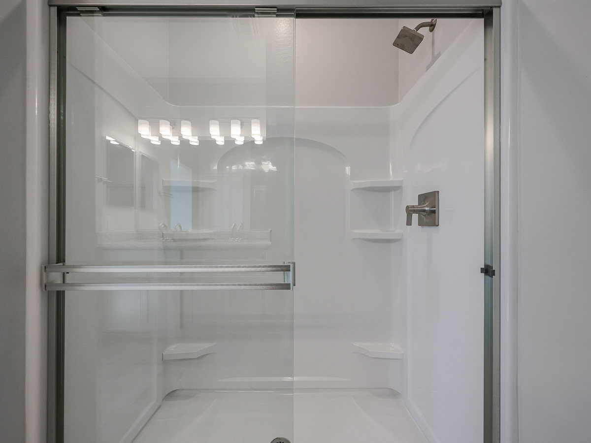 A bathroom with a glass shower.