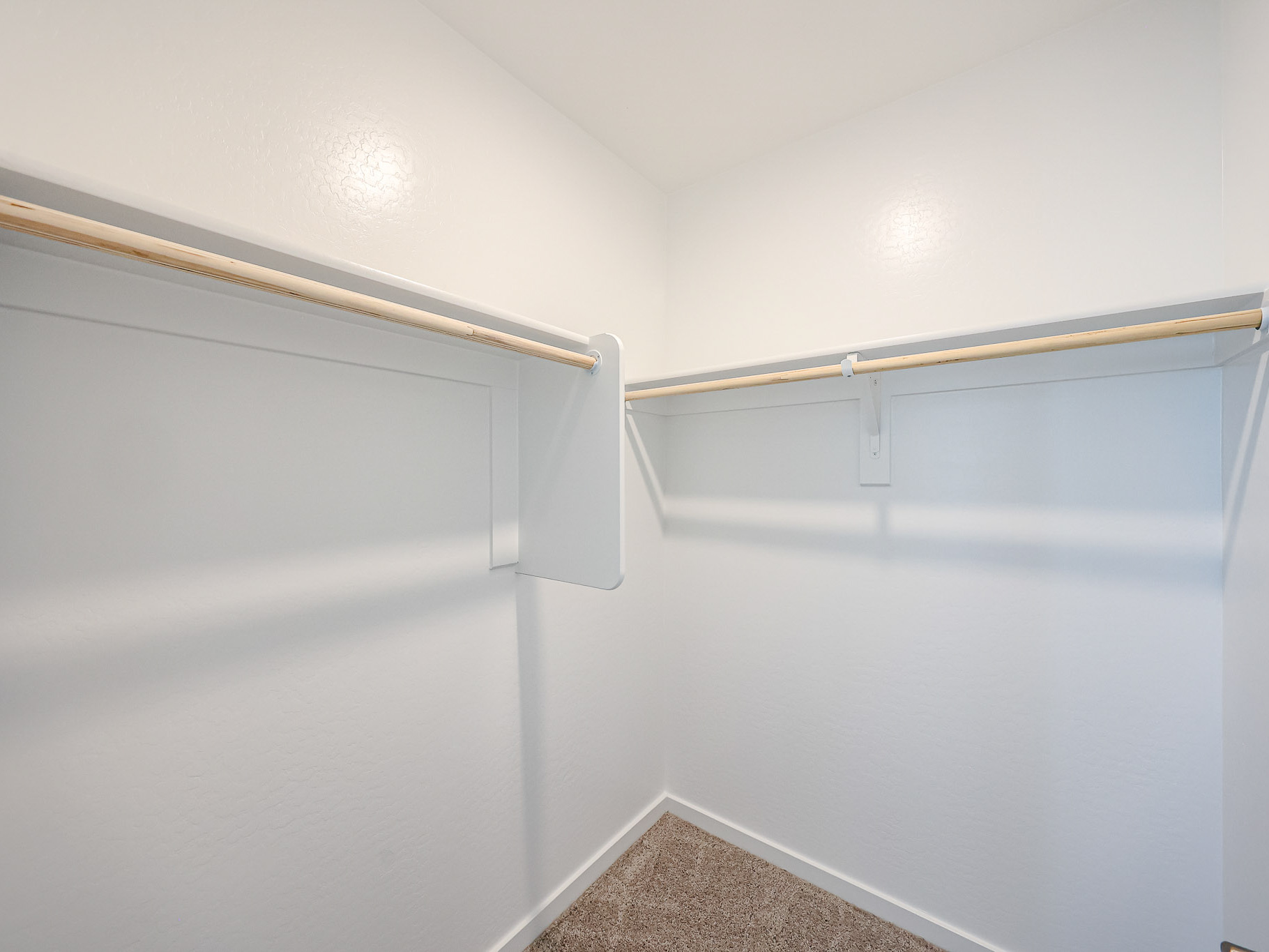 A white wall with a white railing.