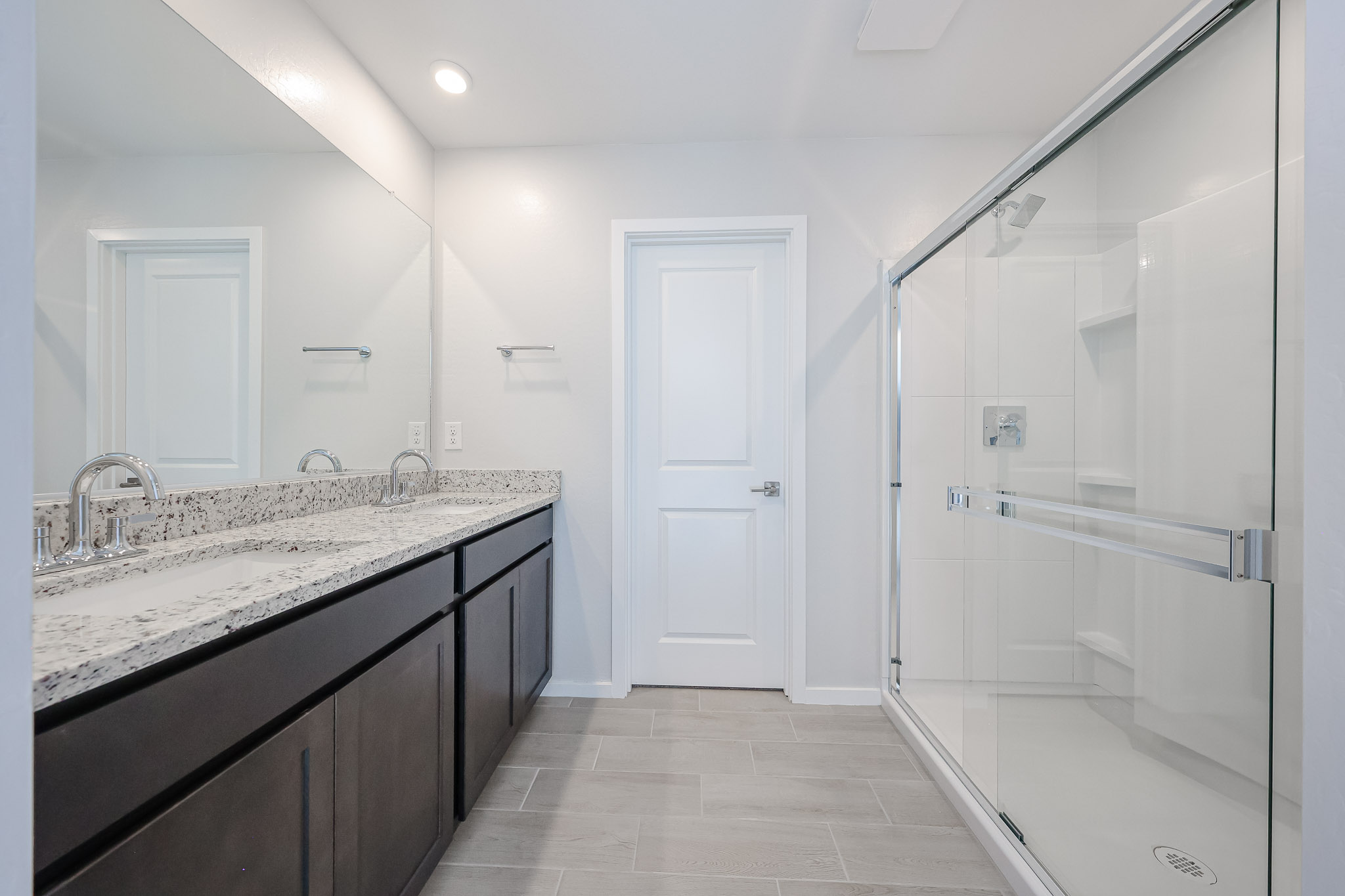 A bathroom with a glass shower.