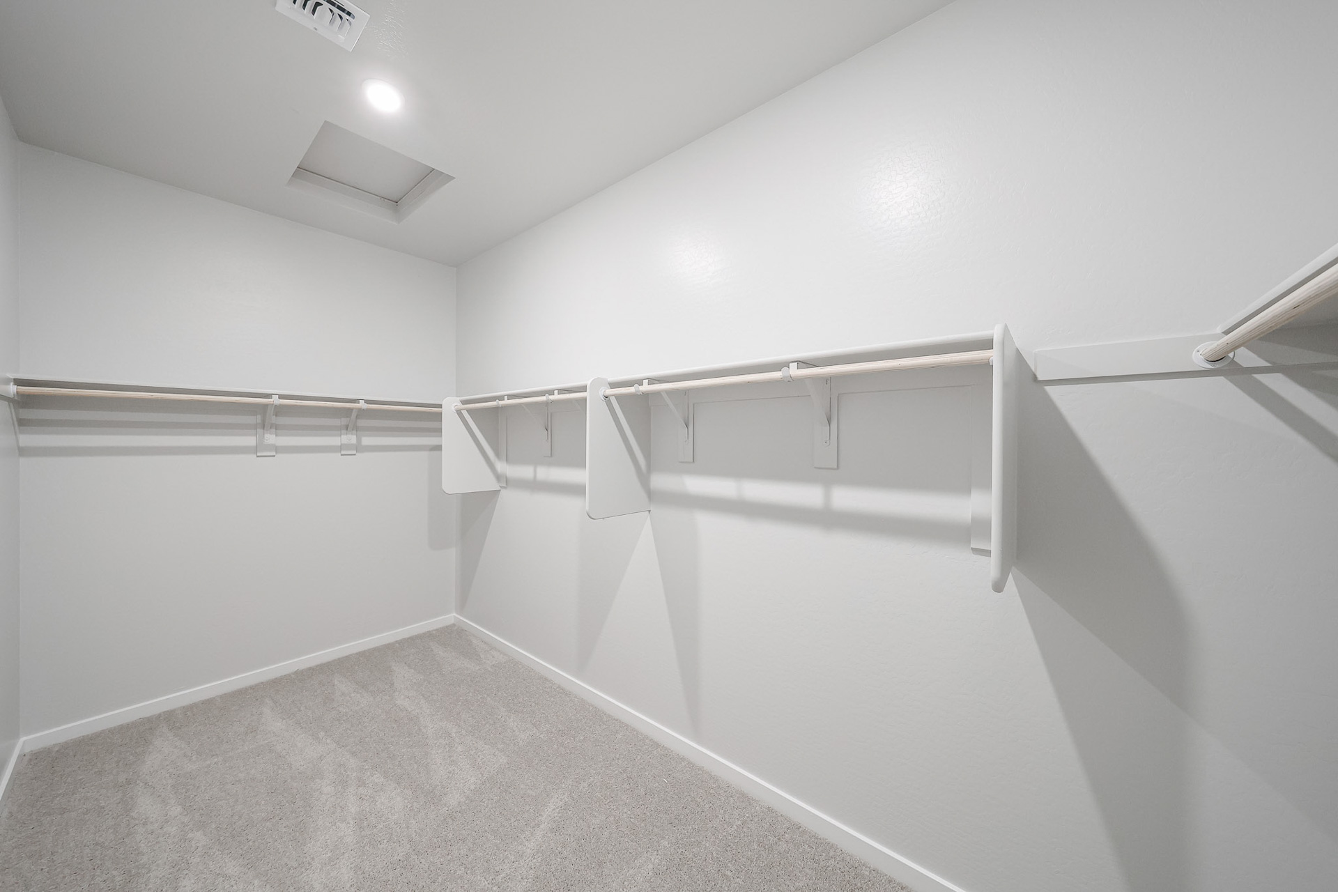 A white staircase in a room.