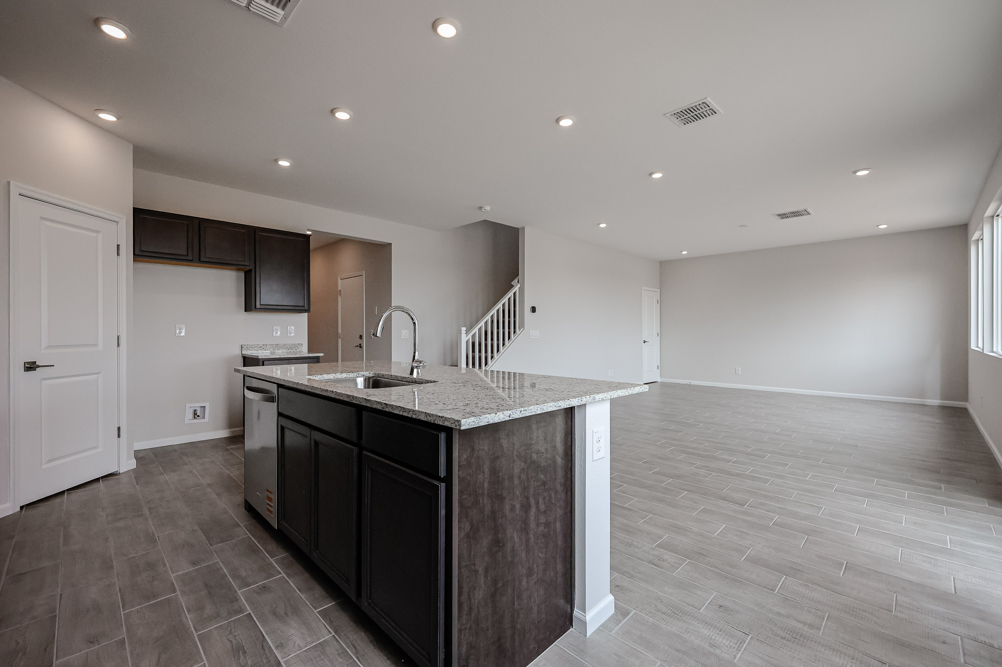 A kitchen with a marble countertop.
