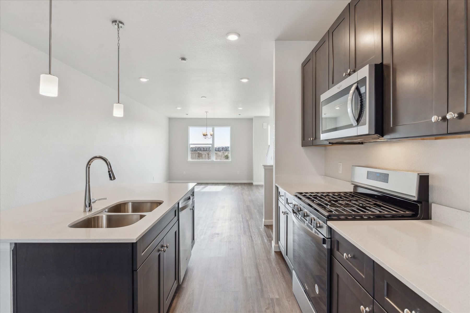 A kitchen with black cabinets.