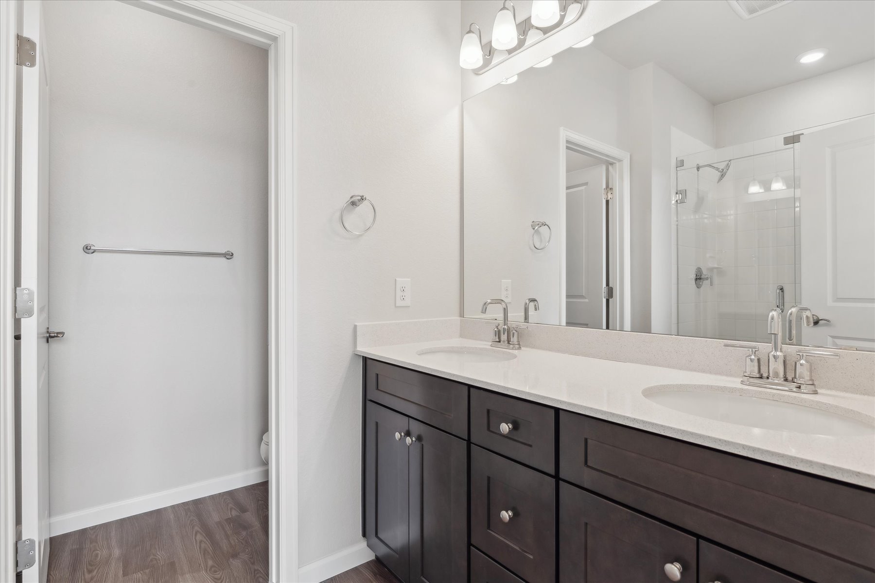 A bathroom with a large mirror.