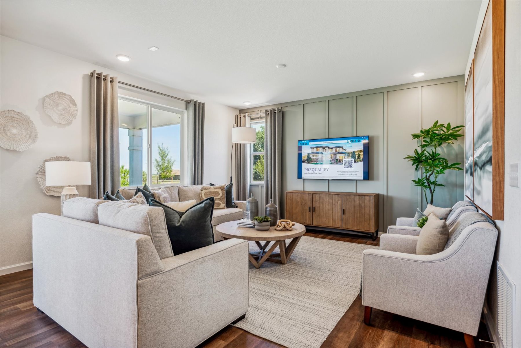 A living room with a tv and couches.