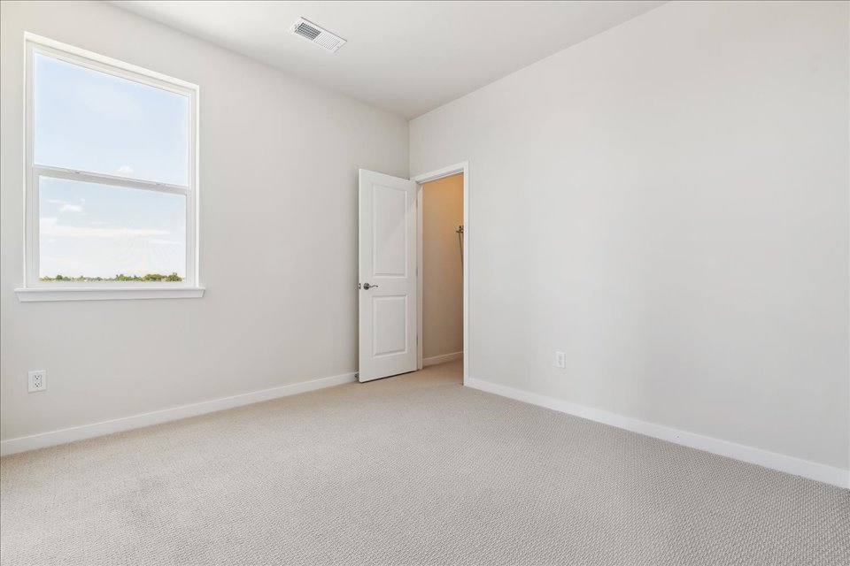 A room with a door and a window.