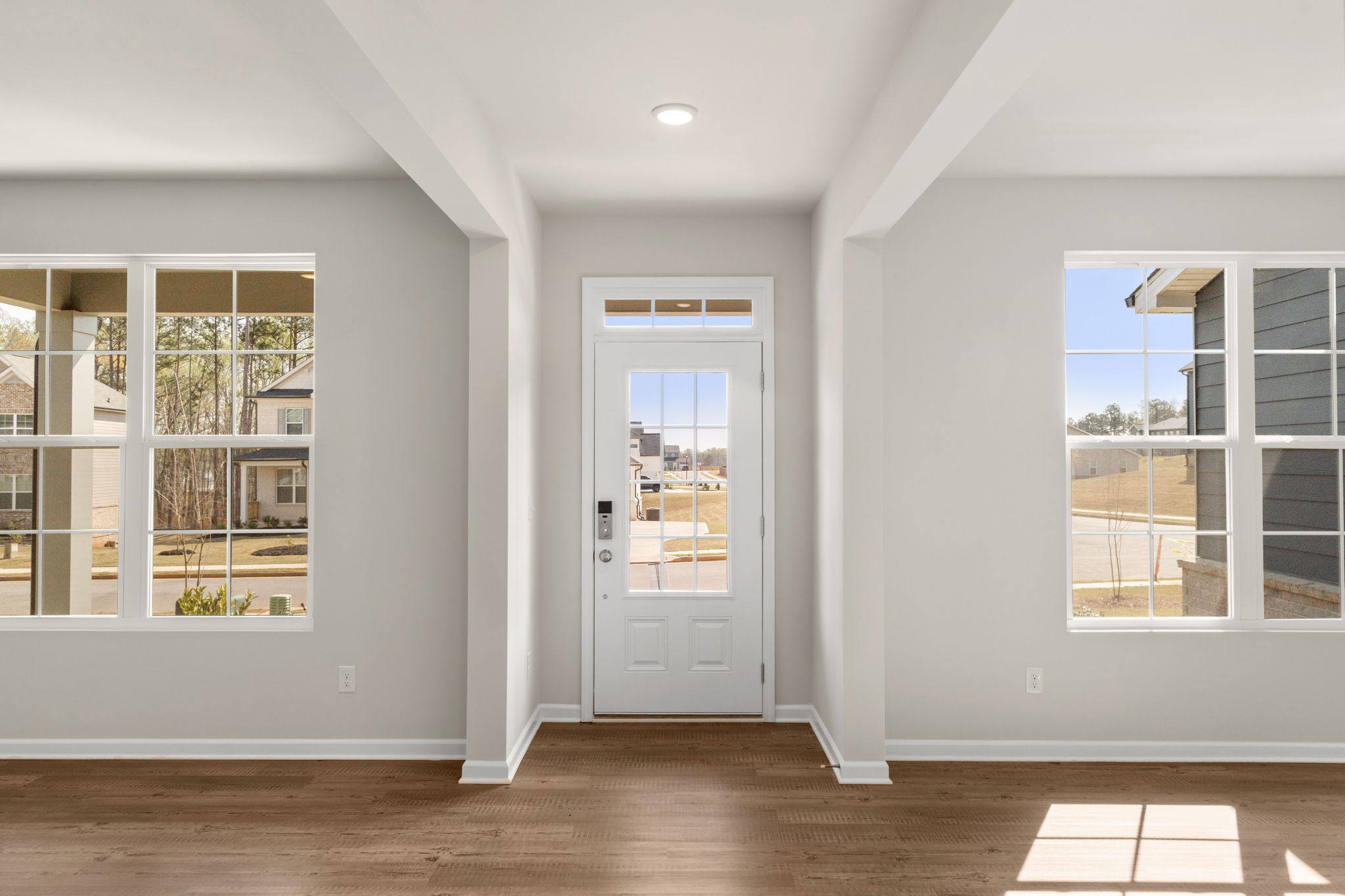 A room with white walls and windows.