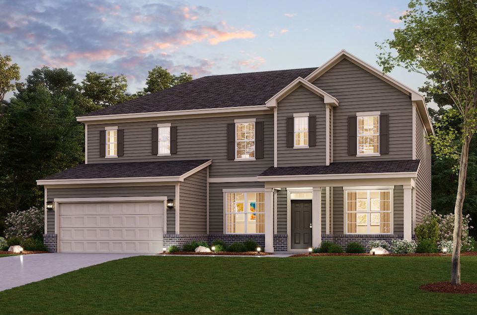 A house with a lawn in front of it.