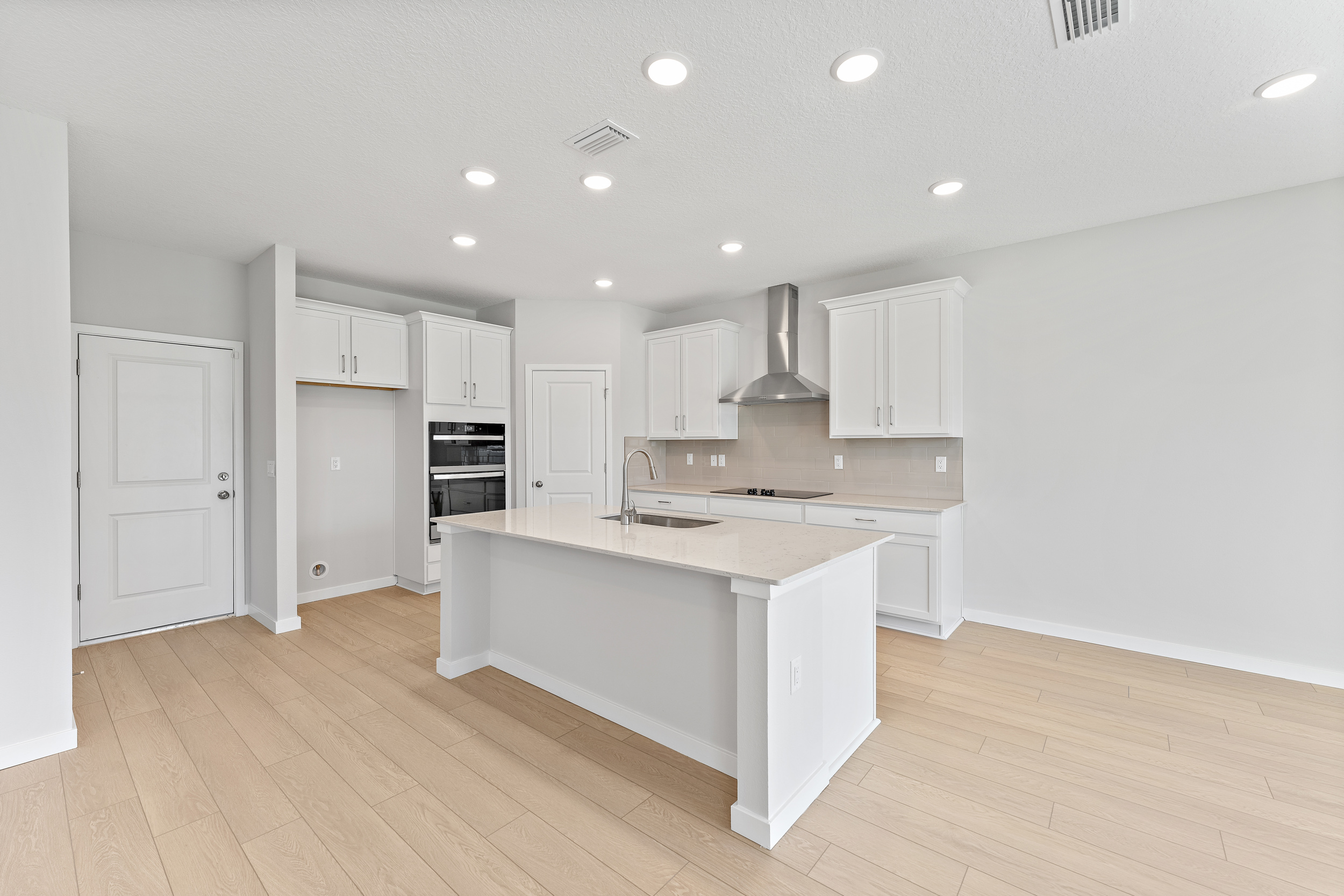 Lot 20 Ponderosa II Chef's Kitchen with Corner Pantry and Island at Camden Woods in Kingsland, GA