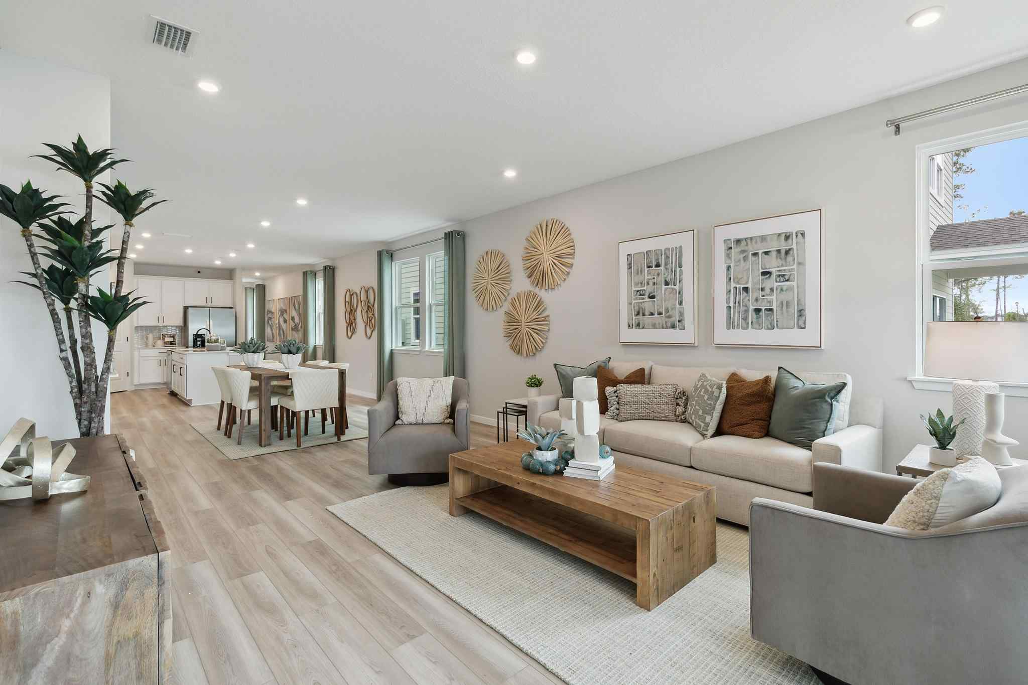 A large living room with a wood floor and a wood floor.