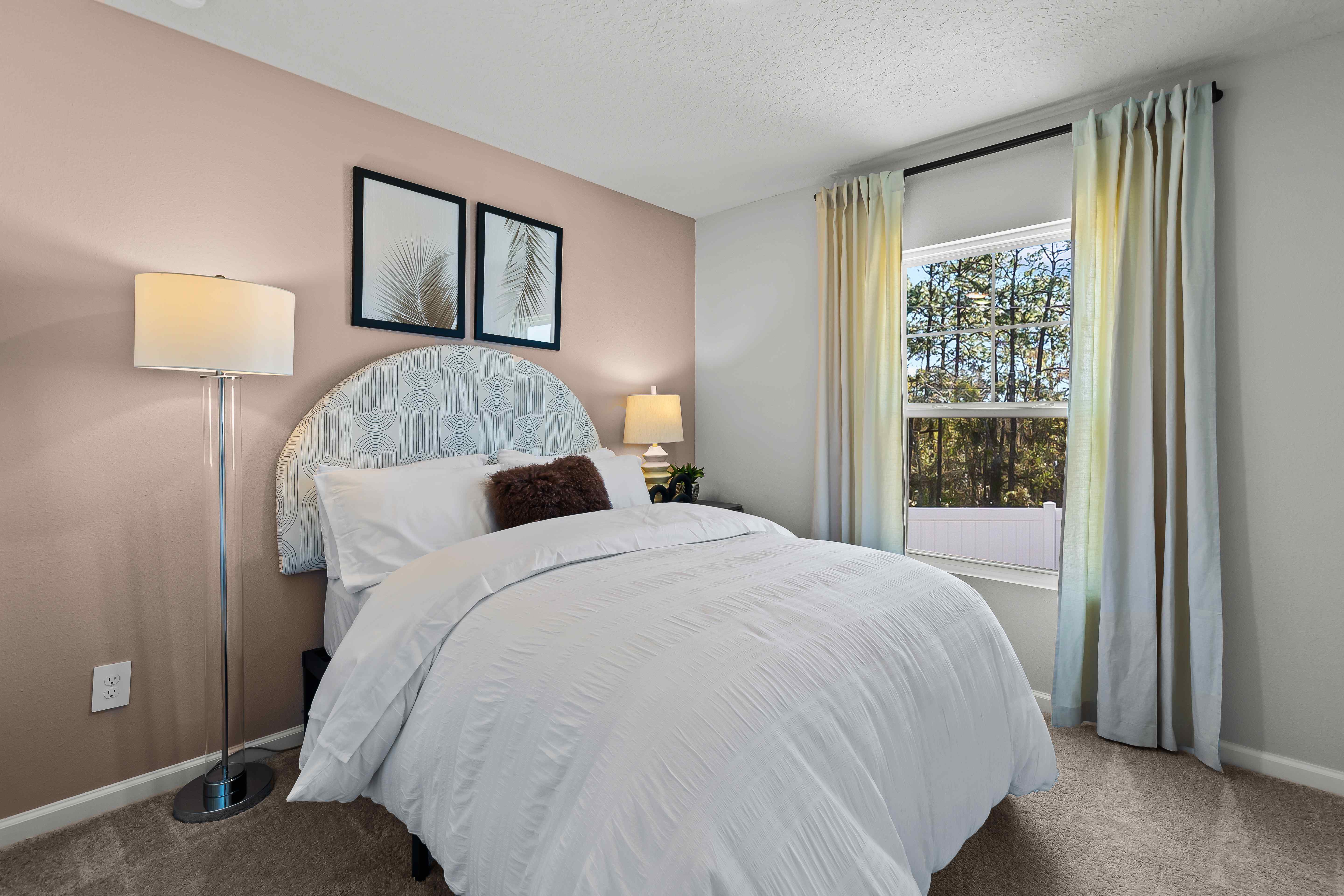 Davor Model Paired Home Guest Bed with Orange Paint Accents at The Landings at Pecan Park