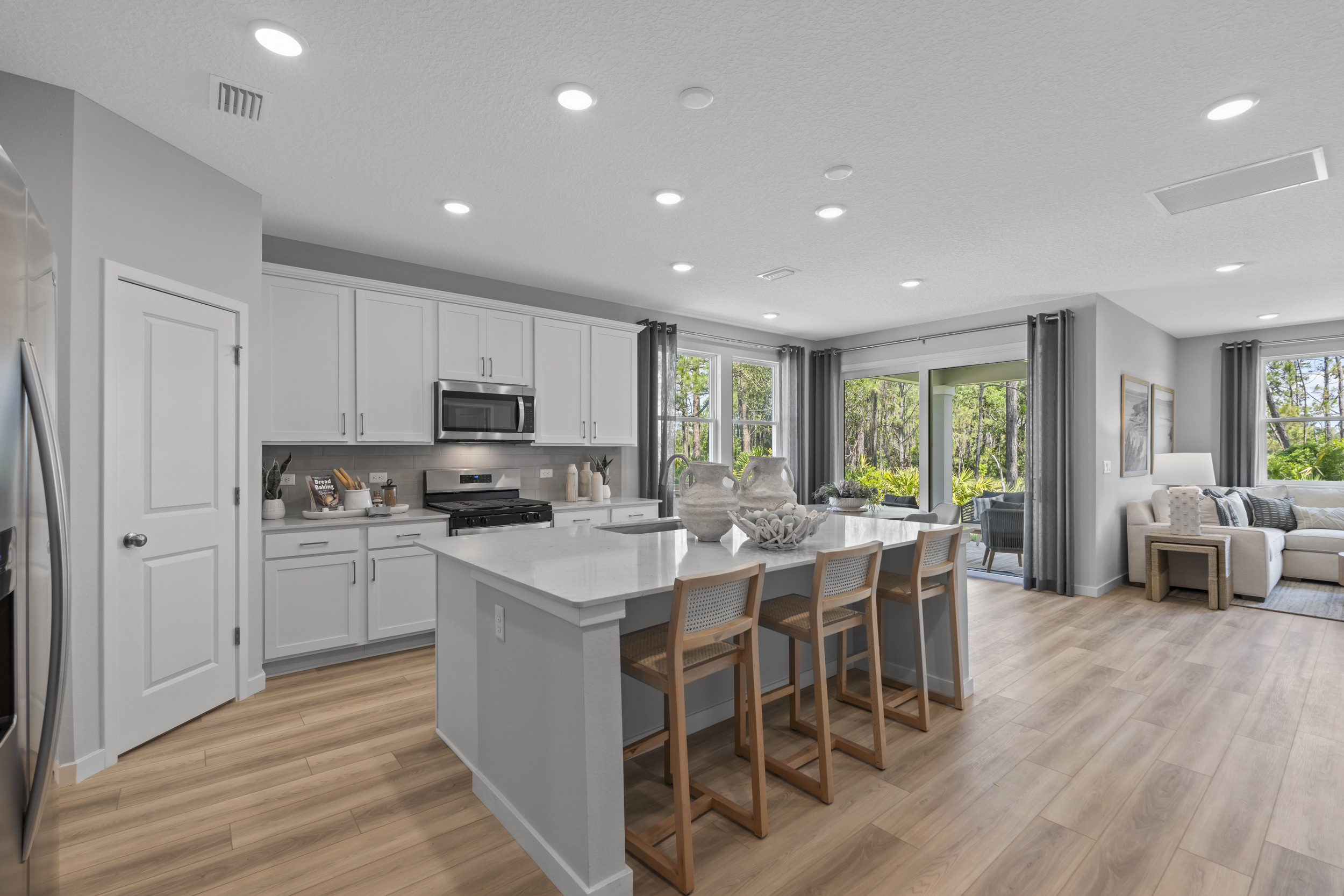 Coronado Model Home Kitchen with White Cabinets at Reserve East in Flagler Beach