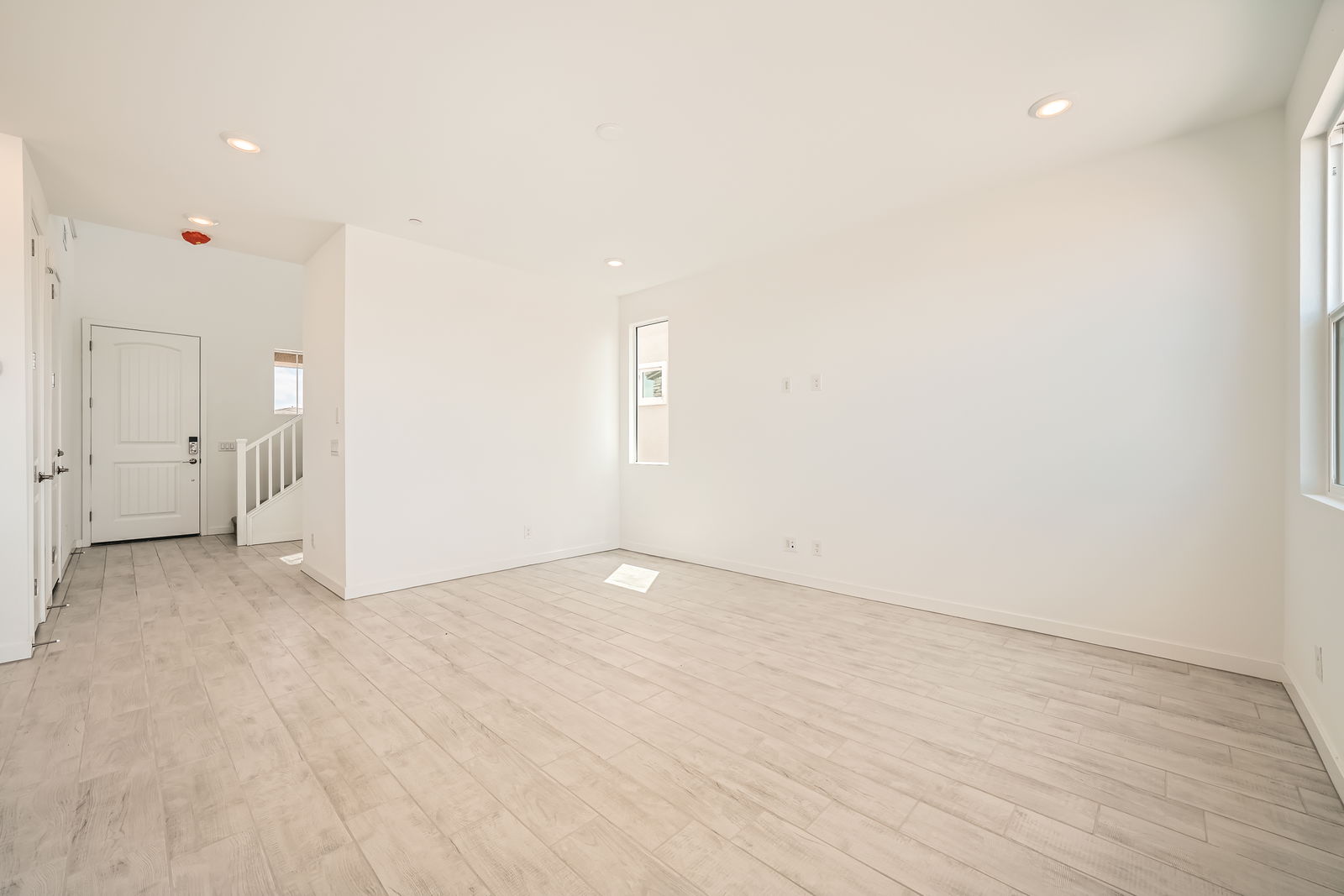 A room with a wood floor.