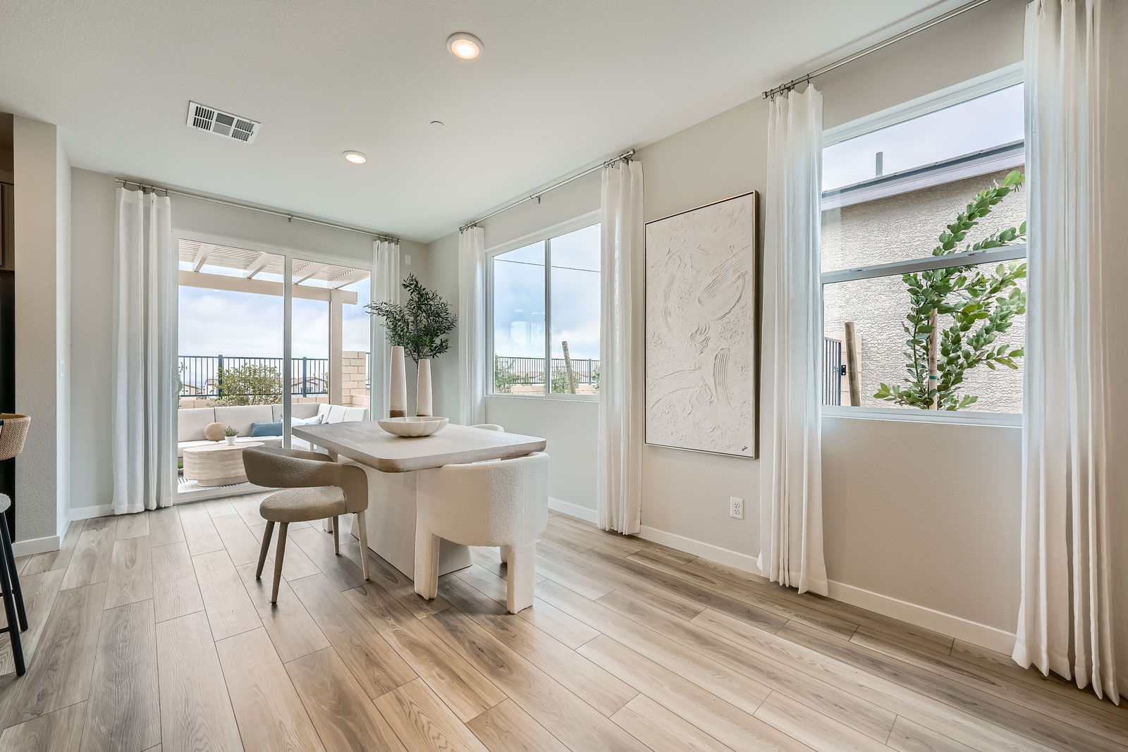 A room with a table and chairs.