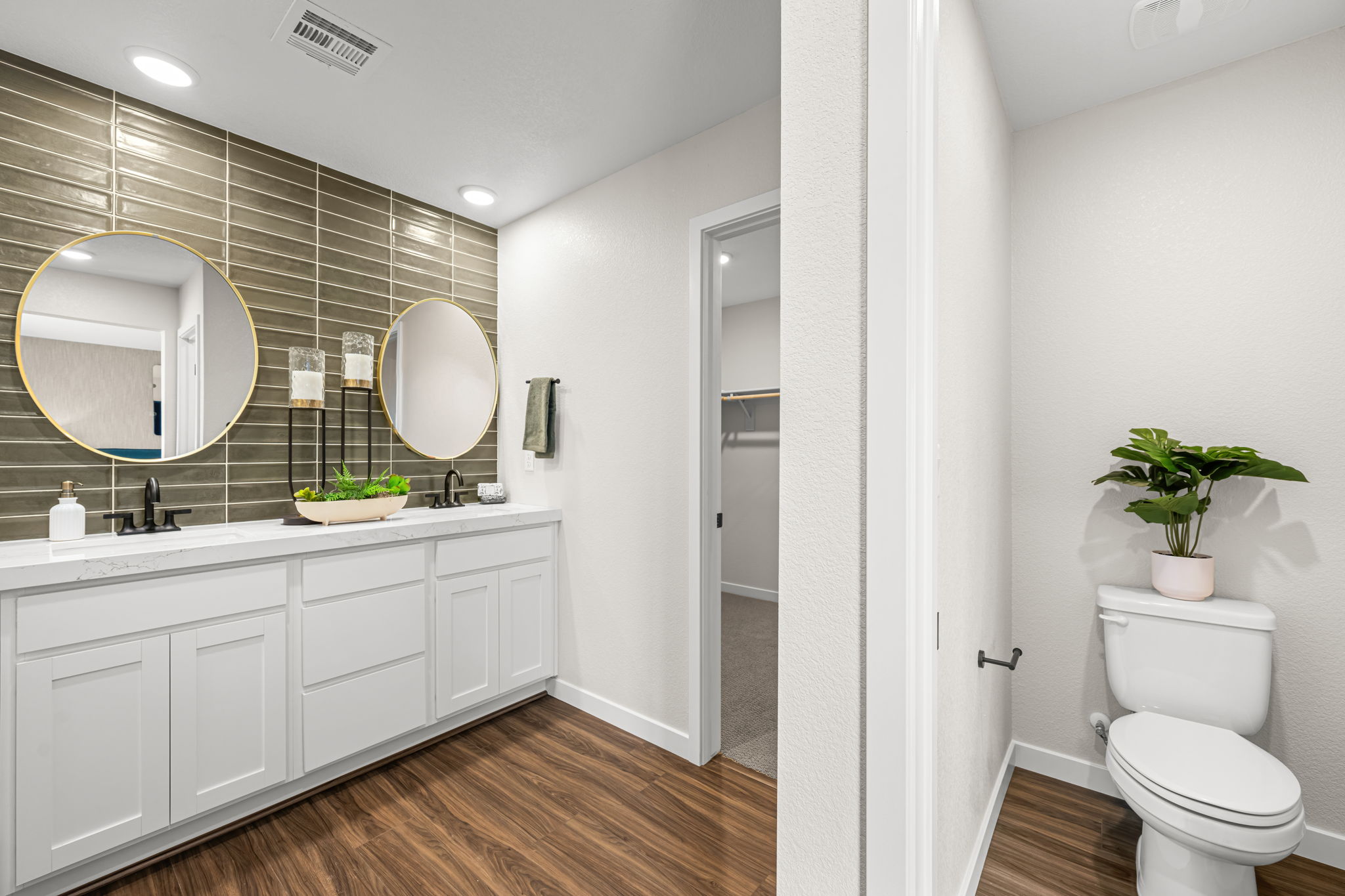 A bathroom with a toilet and sink.