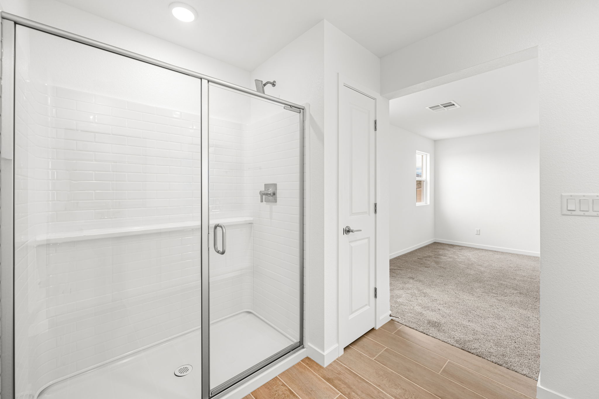 A bathroom with a glass shower.