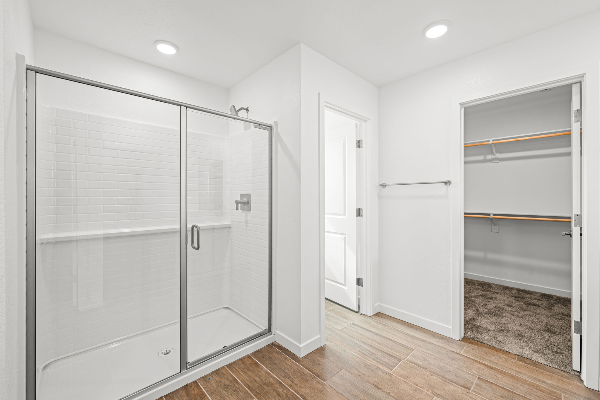 A bathroom with a glass shower.