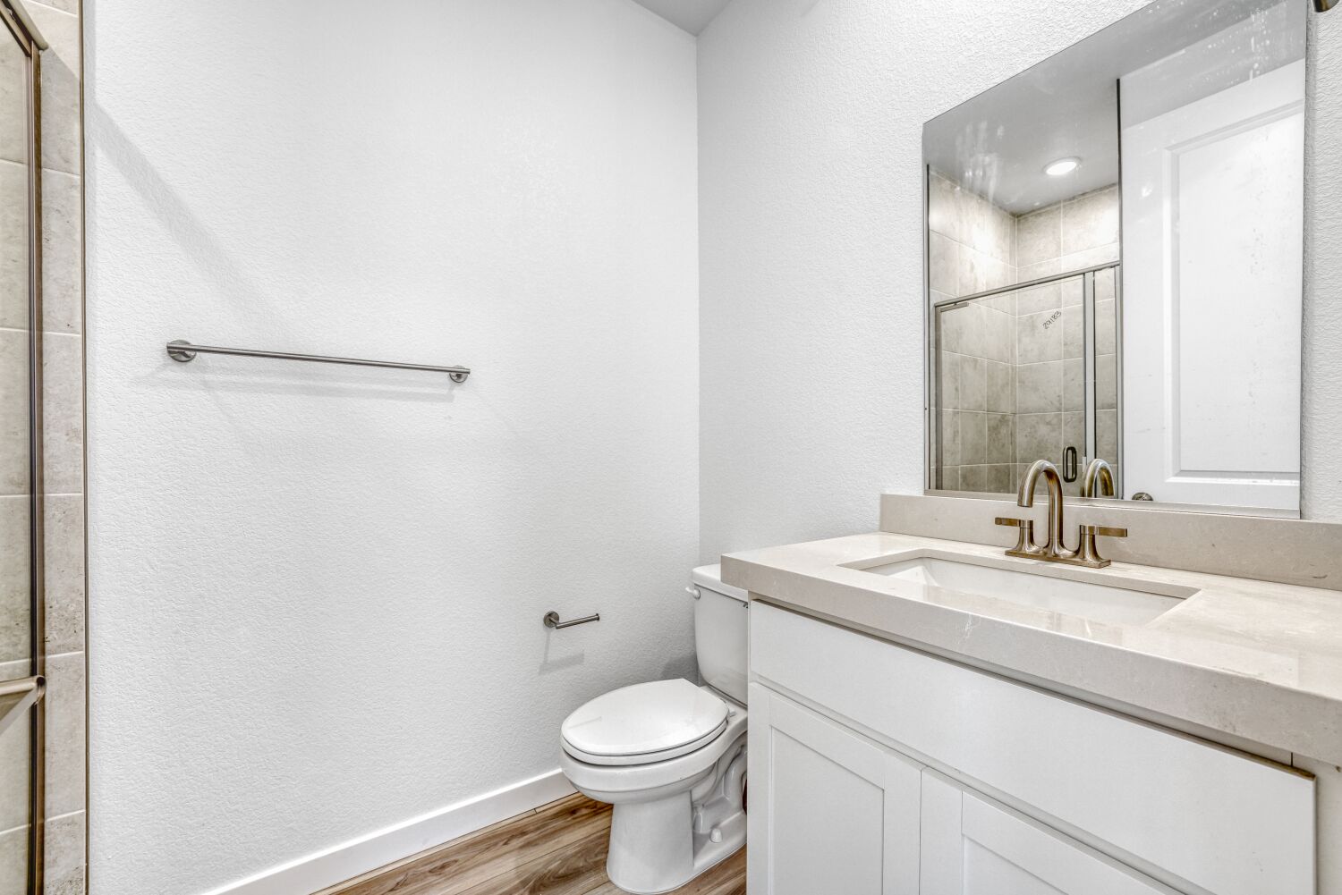 A bathroom with a toilet and sink.