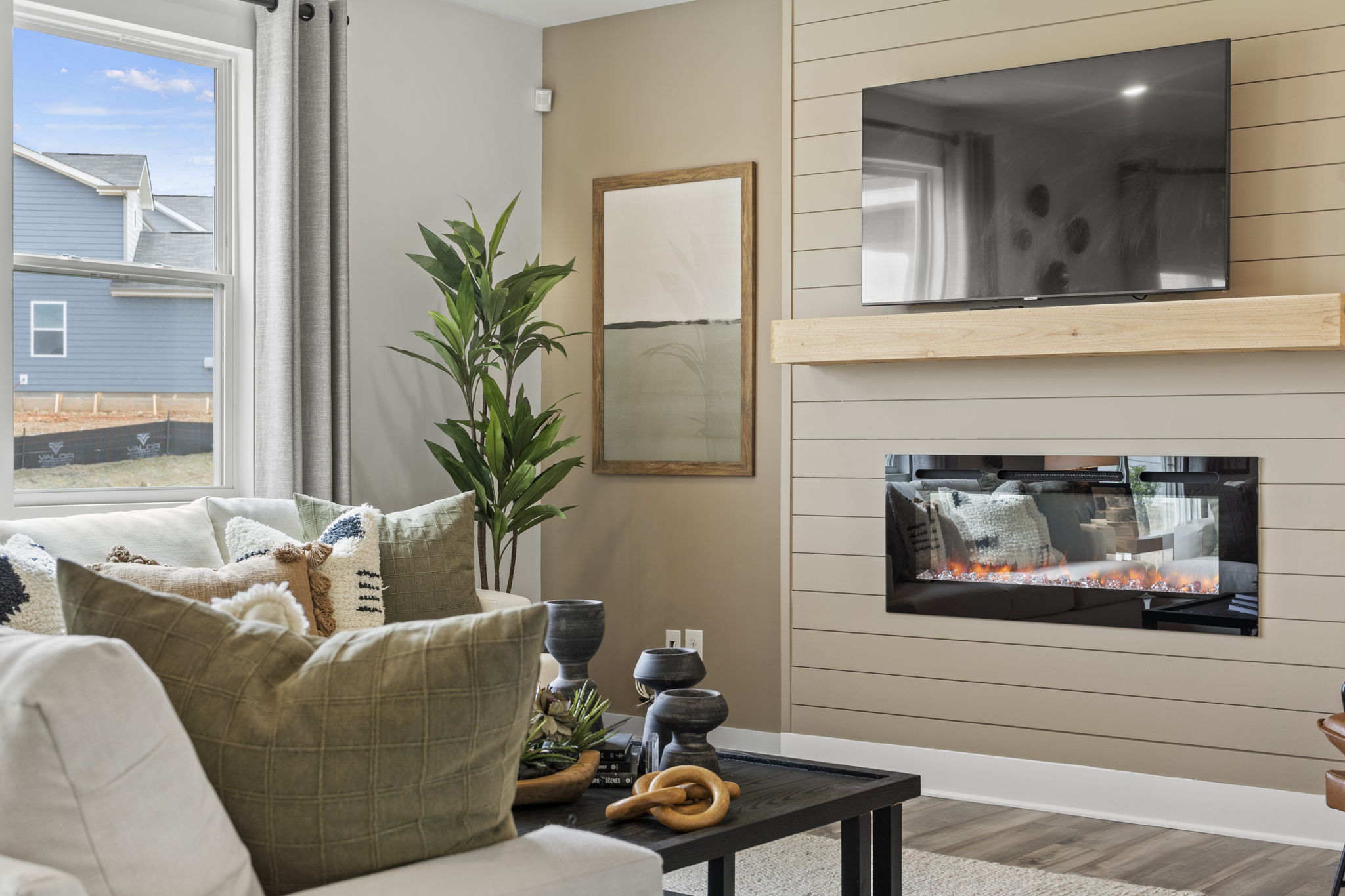 A living room with a fireplace.