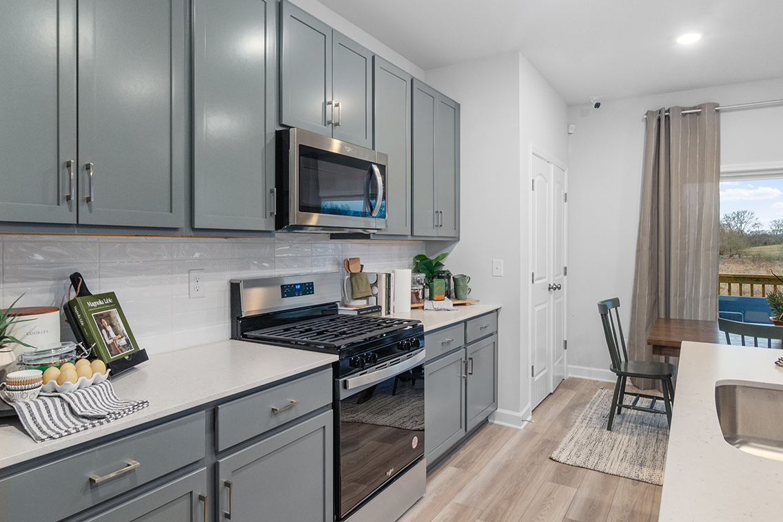 A kitchen with a stove and oven.