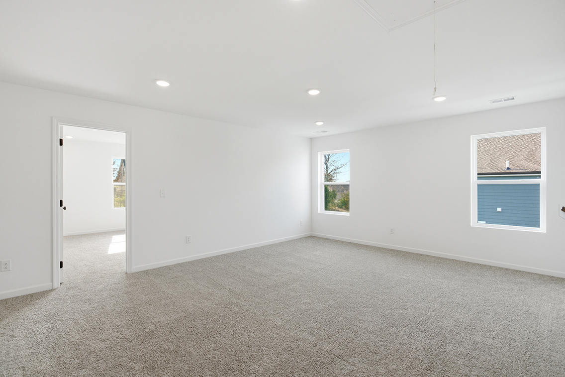 A room with white walls and windows.