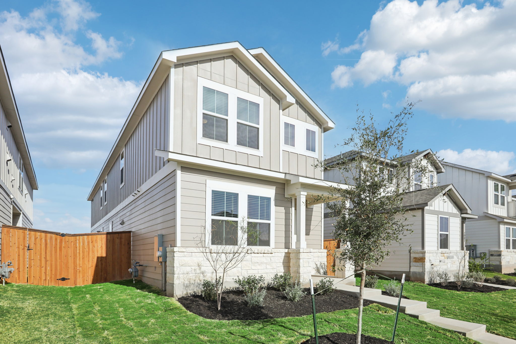 A white house with a fence.