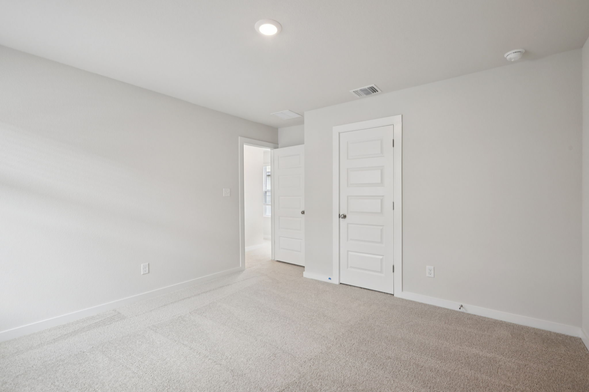 A room with white doors.