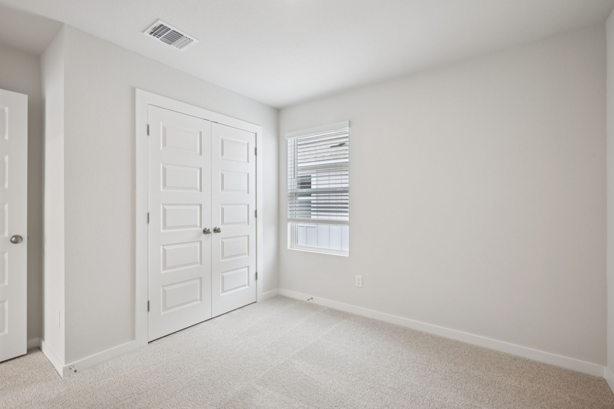 A room with white doors.