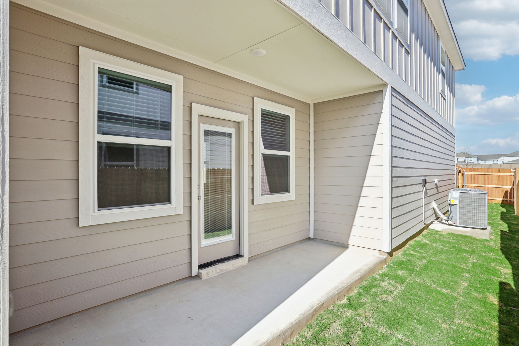 A house with a grass yard.