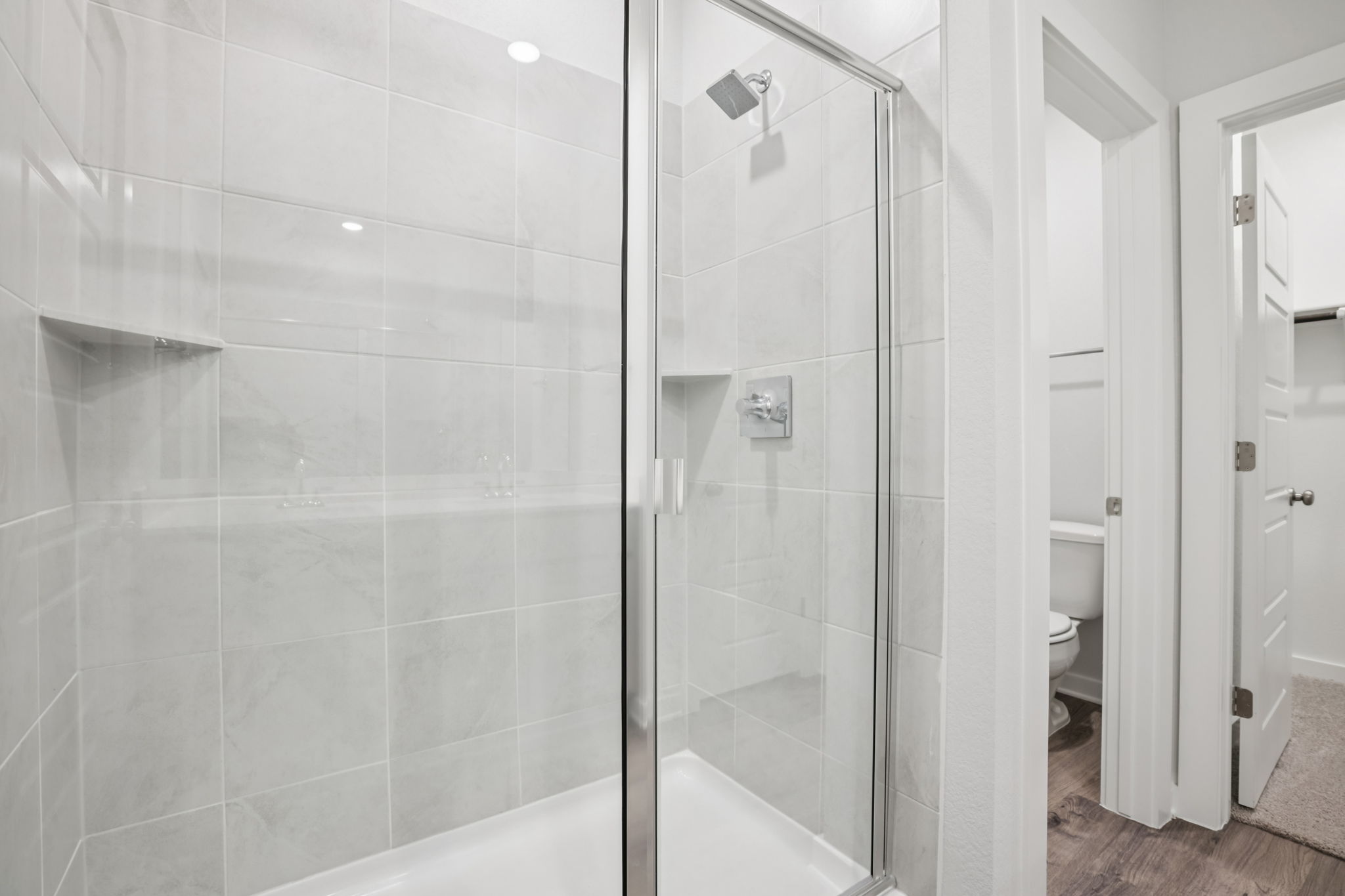 A bathroom with a glass shower.