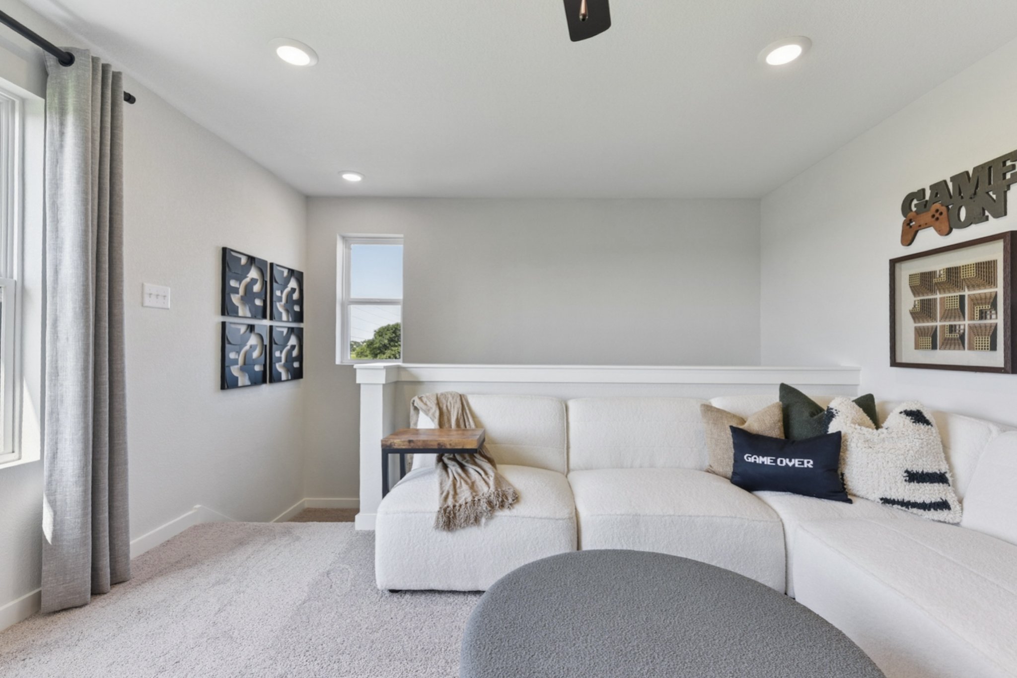 A living room with a couch and a table.