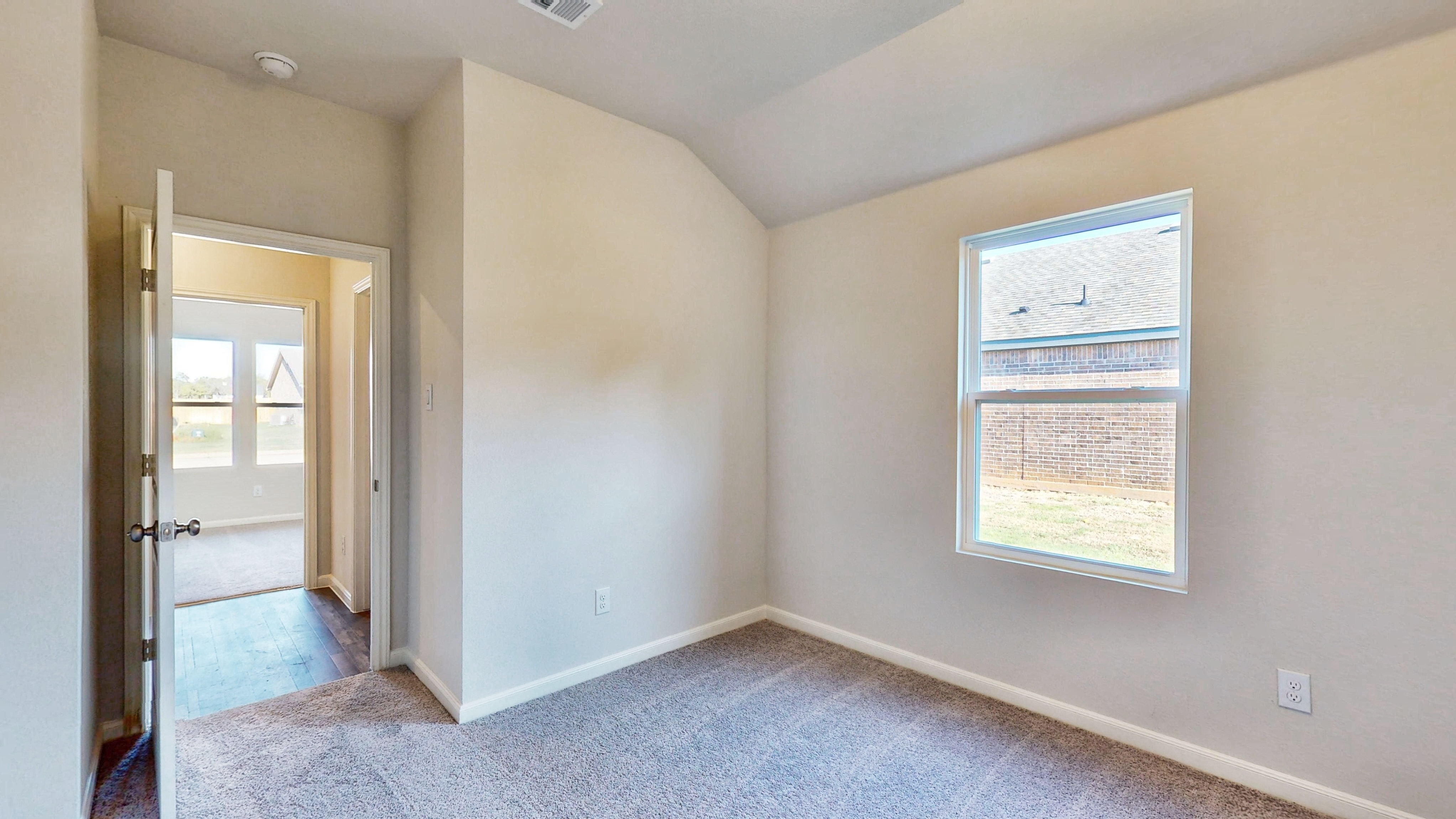 A room with a door and a window.