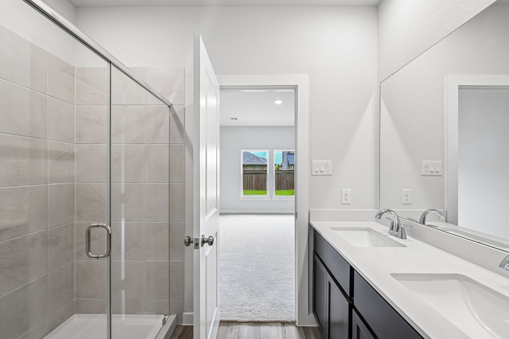 A bathroom with a glass shower.