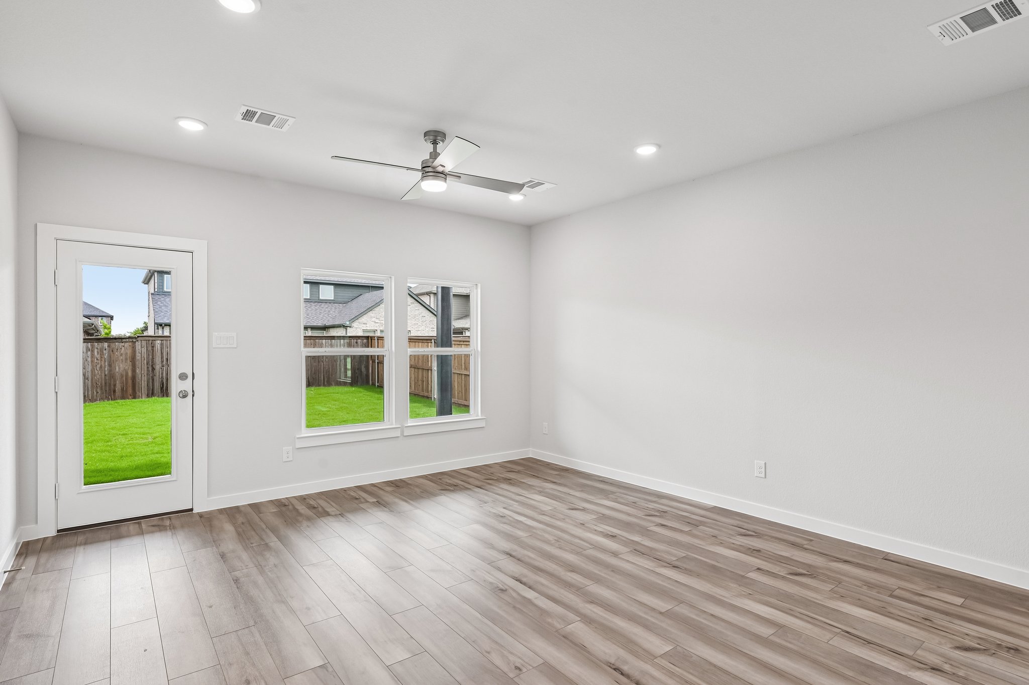 A room with a wood floor and a wood floor with a wood floor.