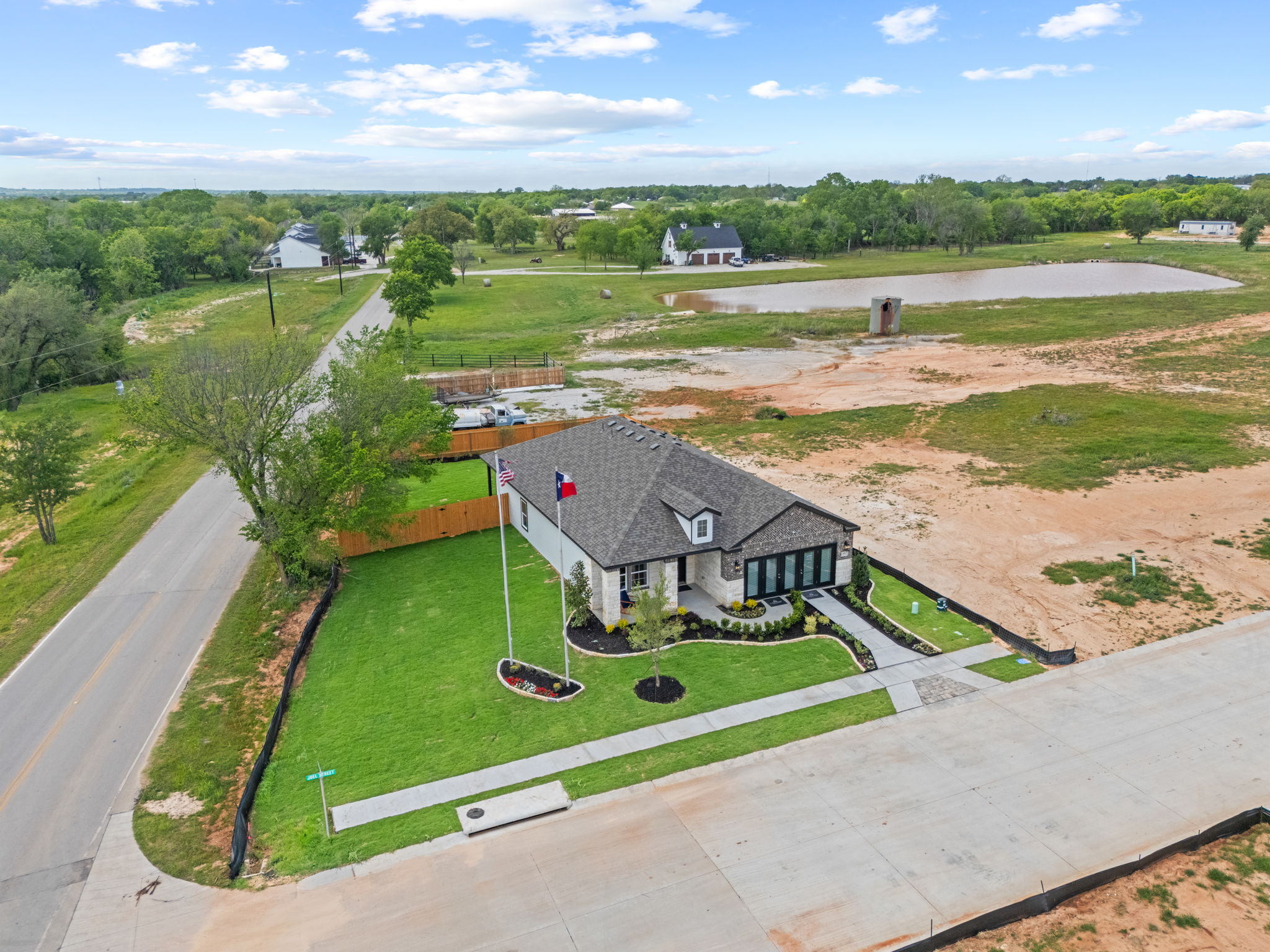A house with a car parked in the driveway.
