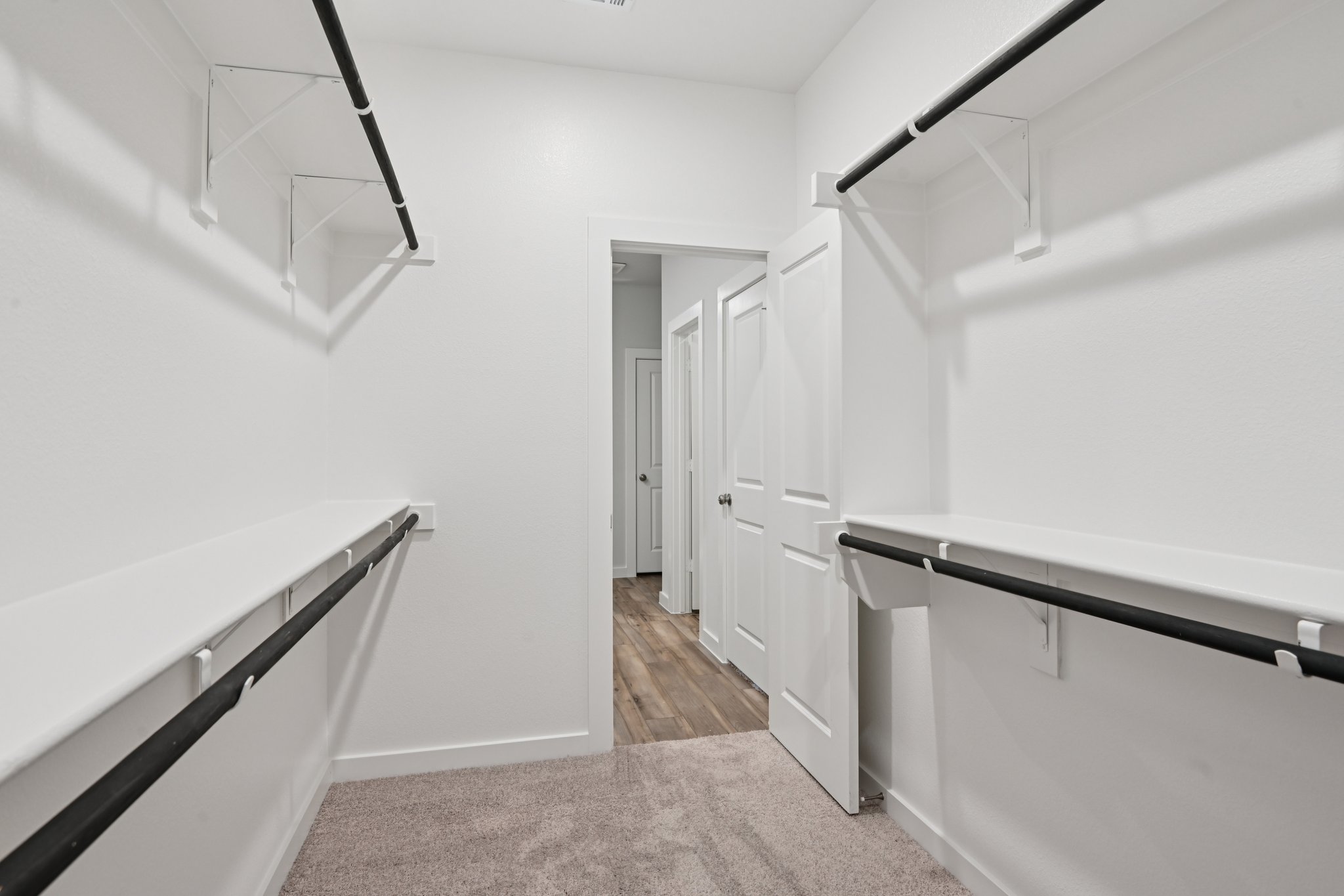 A hallway with white walls.